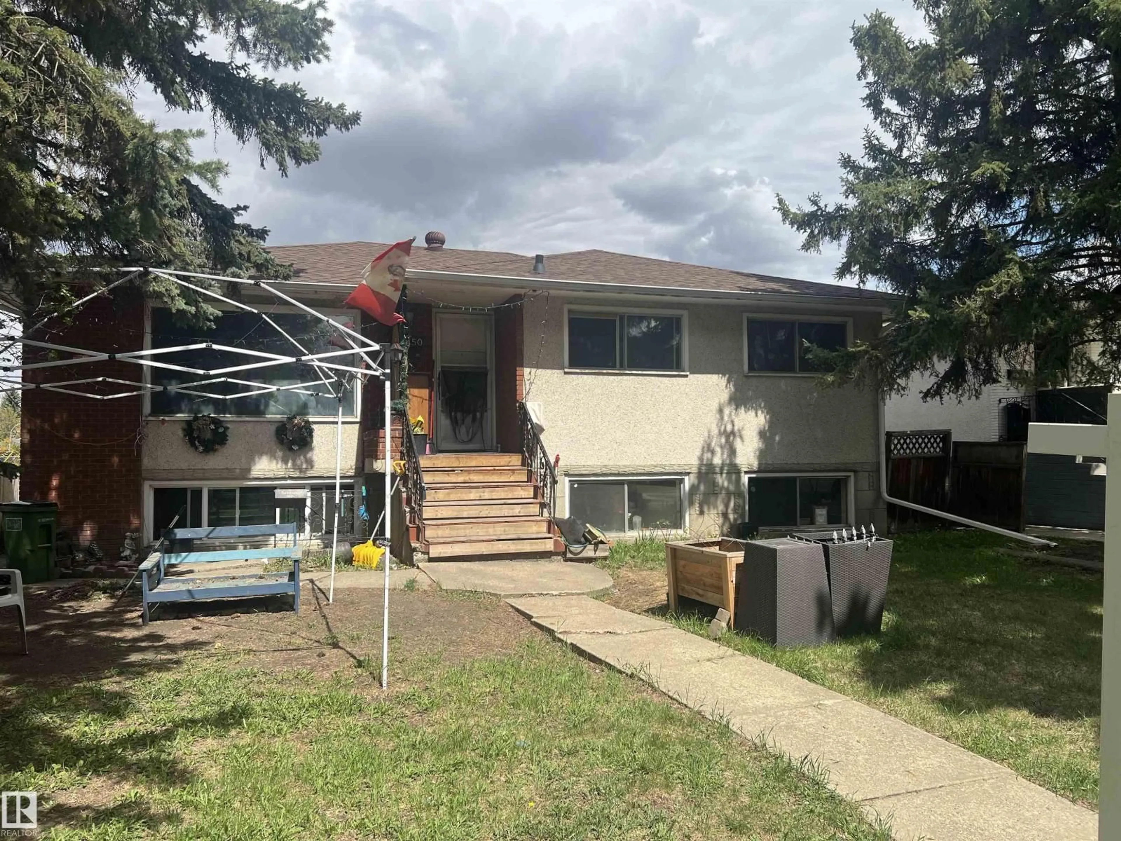 Home with vinyl exterior material, street for 10450 69 AV, Edmonton Alberta T6H2C3