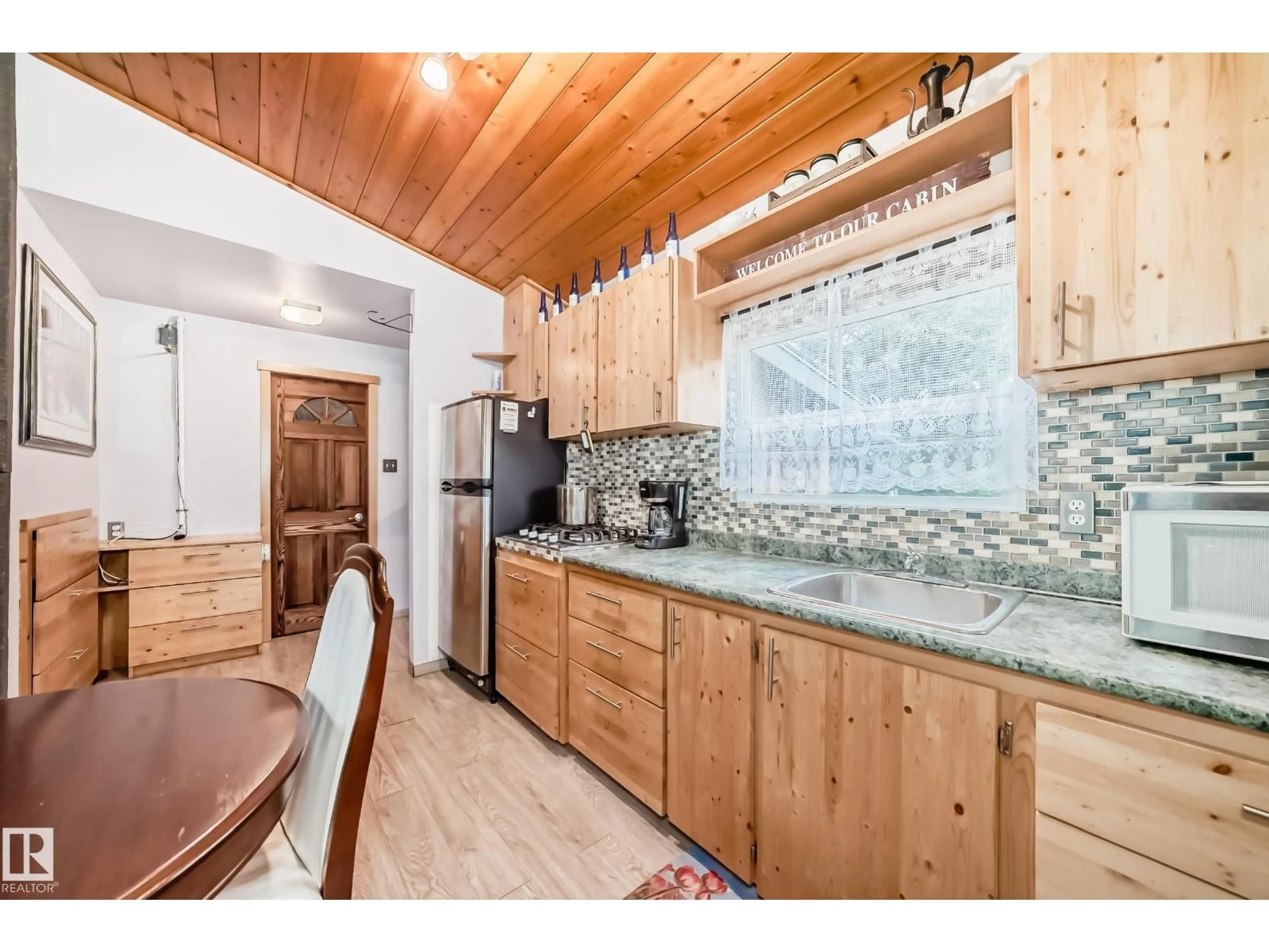 Open concept kitchen, wood/laminate floor for 575040 RANGE ROAD 173, Rural Lamont County Alberta T0B0W0