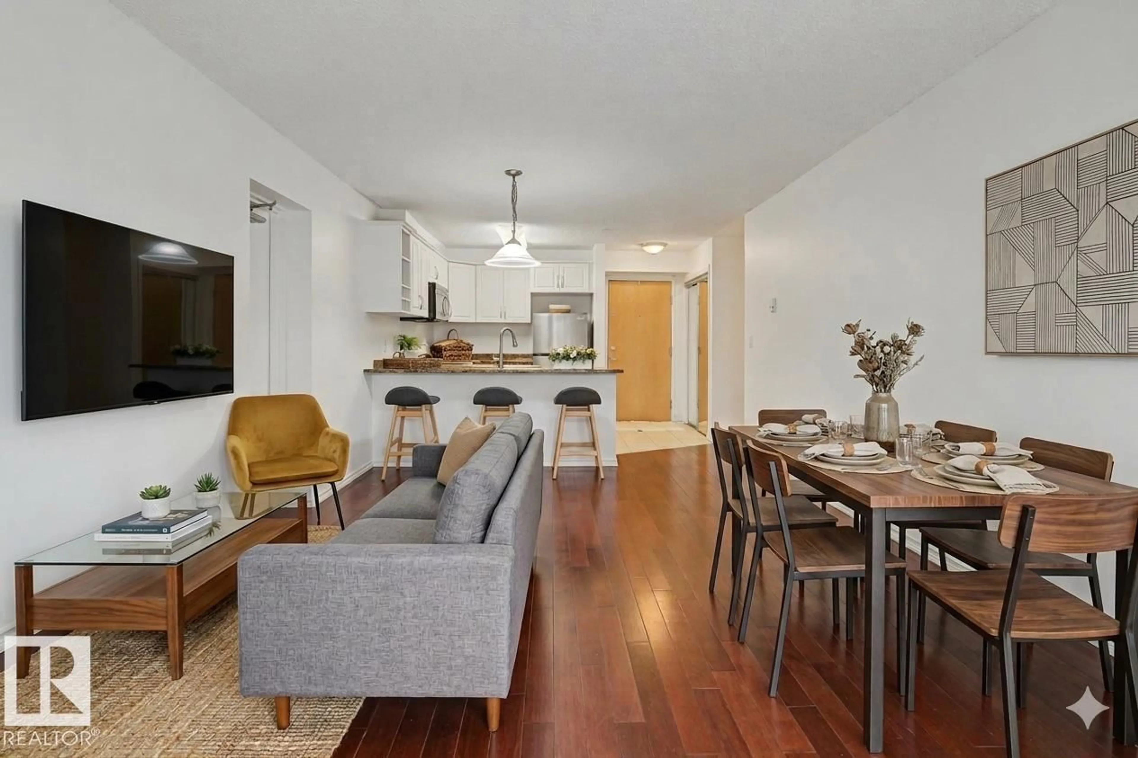 Living room with furniture, wood/laminate floor for #213 - 17404 64 AV, Edmonton Alberta T5T6X4