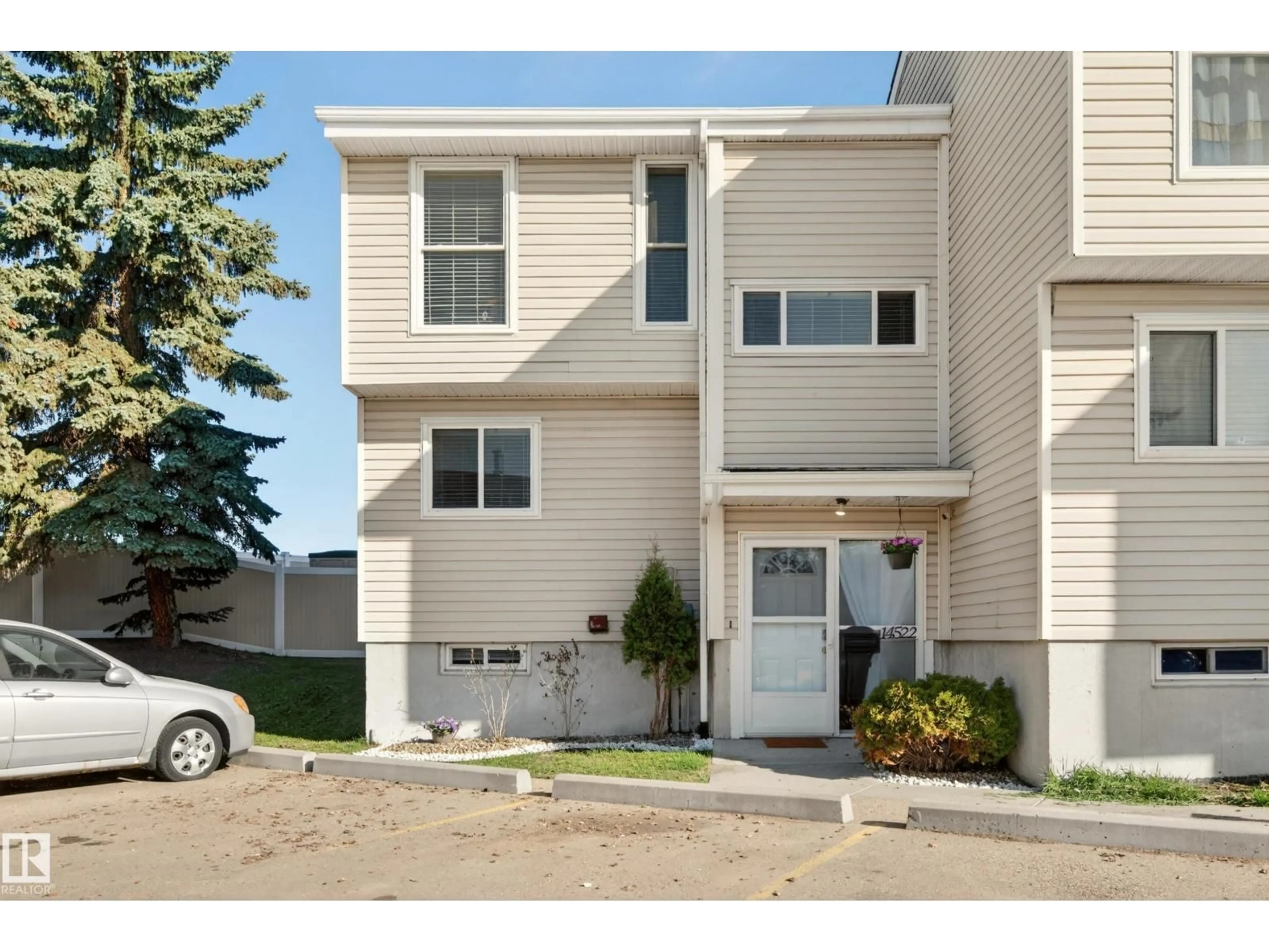 Home with vinyl exterior material, street for NW - 14522 56 ST, Edmonton Alberta T5A3R1