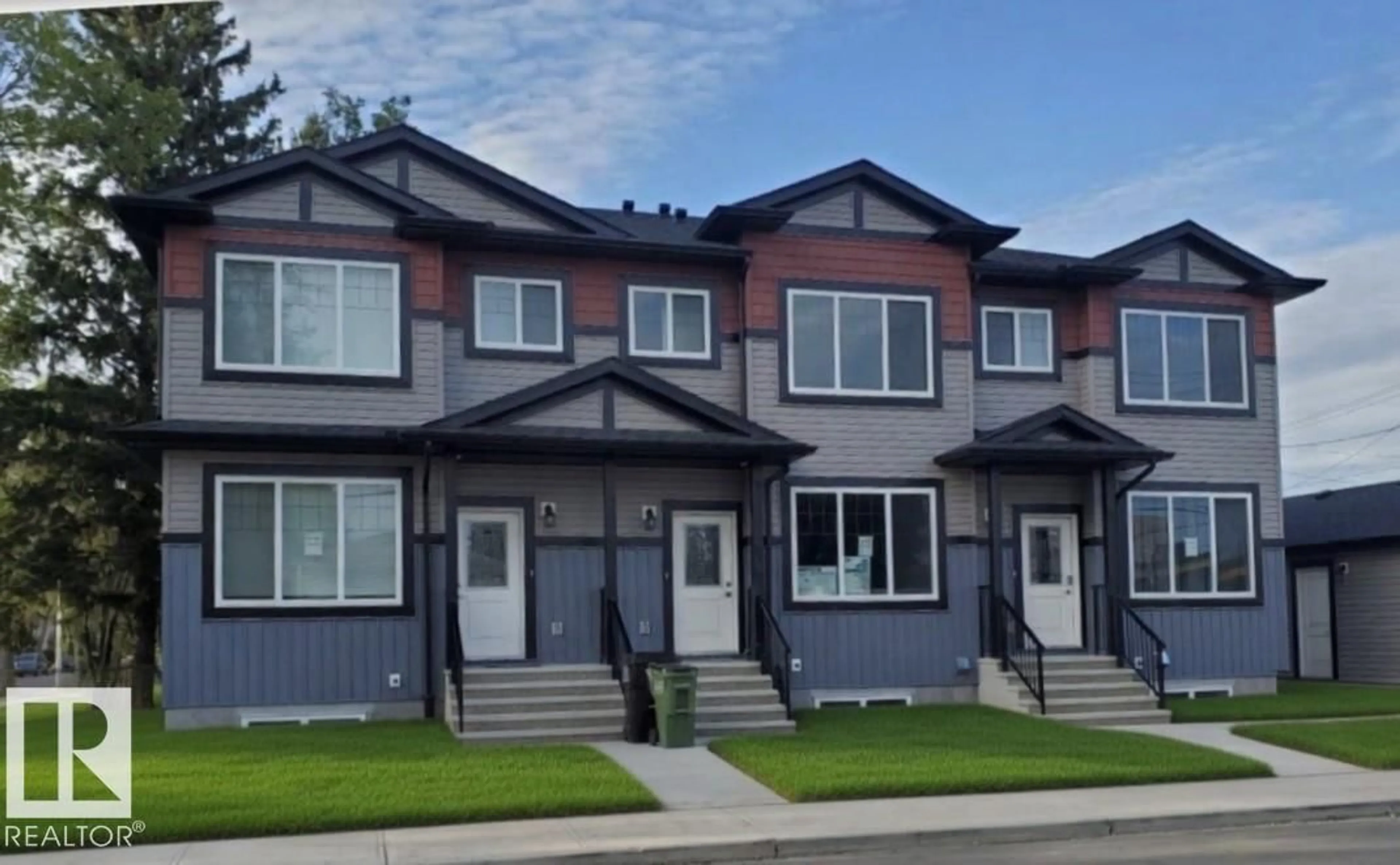 Home with vinyl exterior material, street for NW - 12104 120 AV, Edmonton Alberta T5L3B8