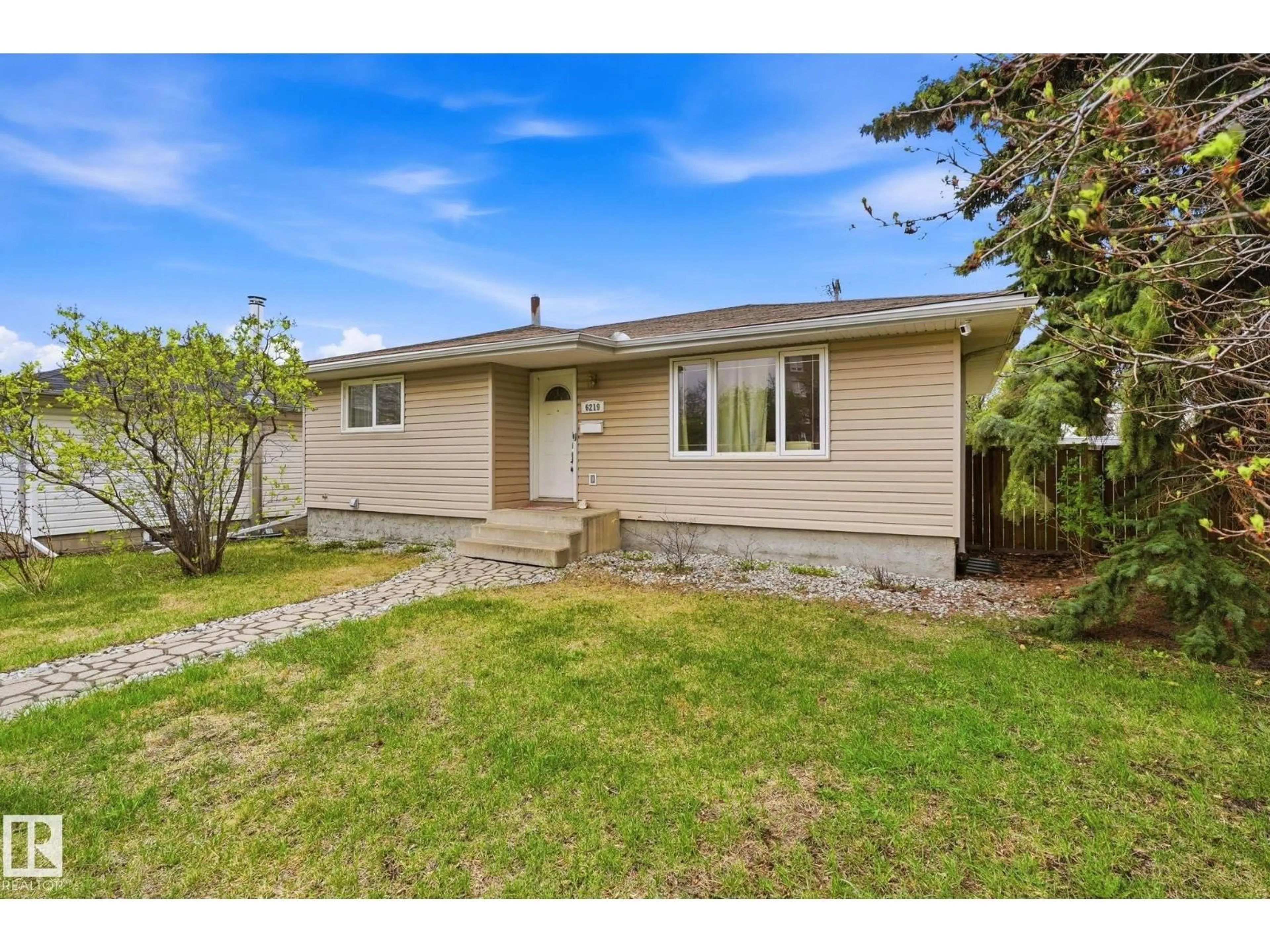 Home with vinyl exterior material, street for NW - 6219 134 AV, Edmonton Alberta T5A0L7