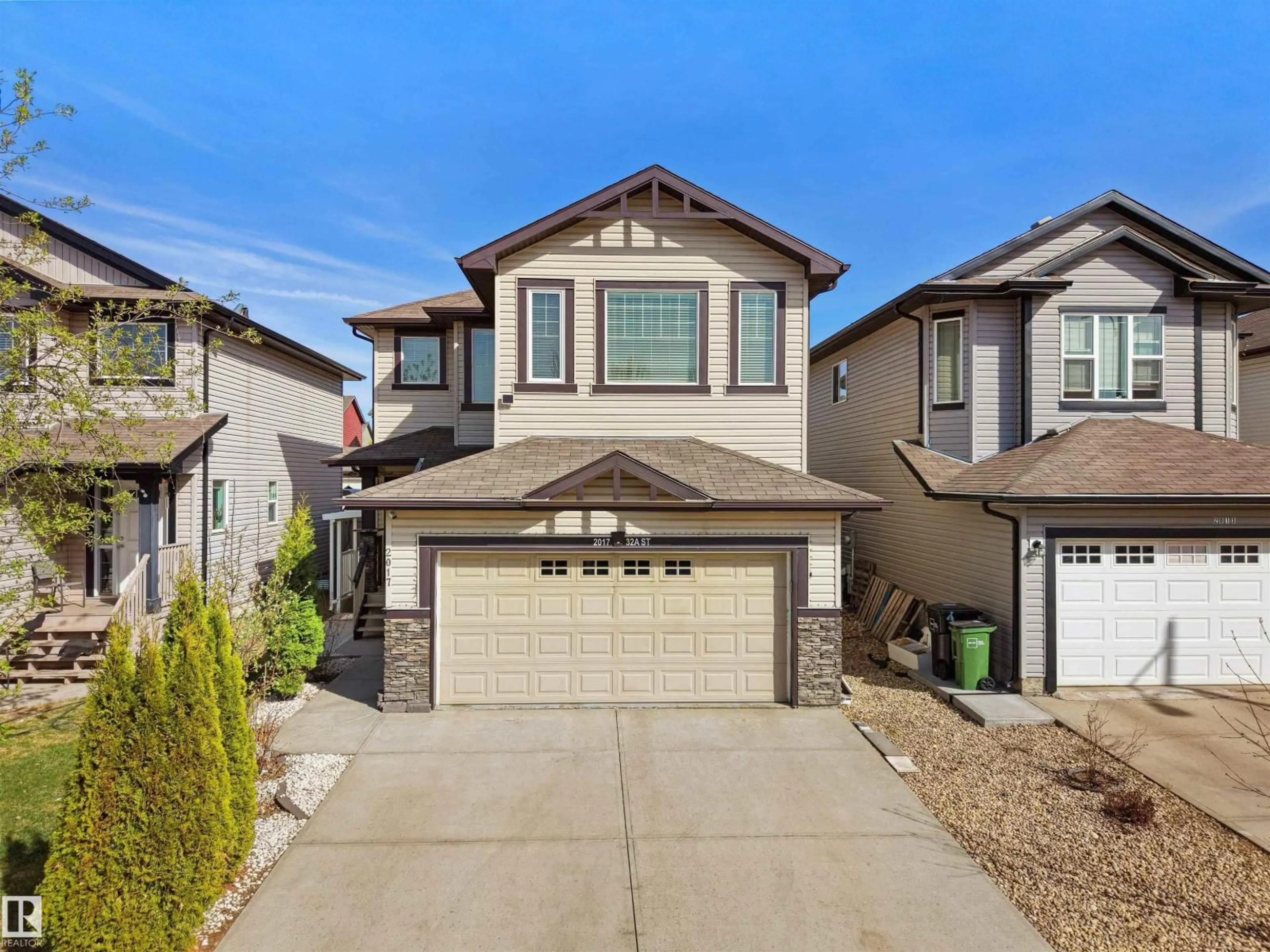 Home with vinyl exterior material, street for 2017 32A ST, Edmonton Alberta T6T0L6