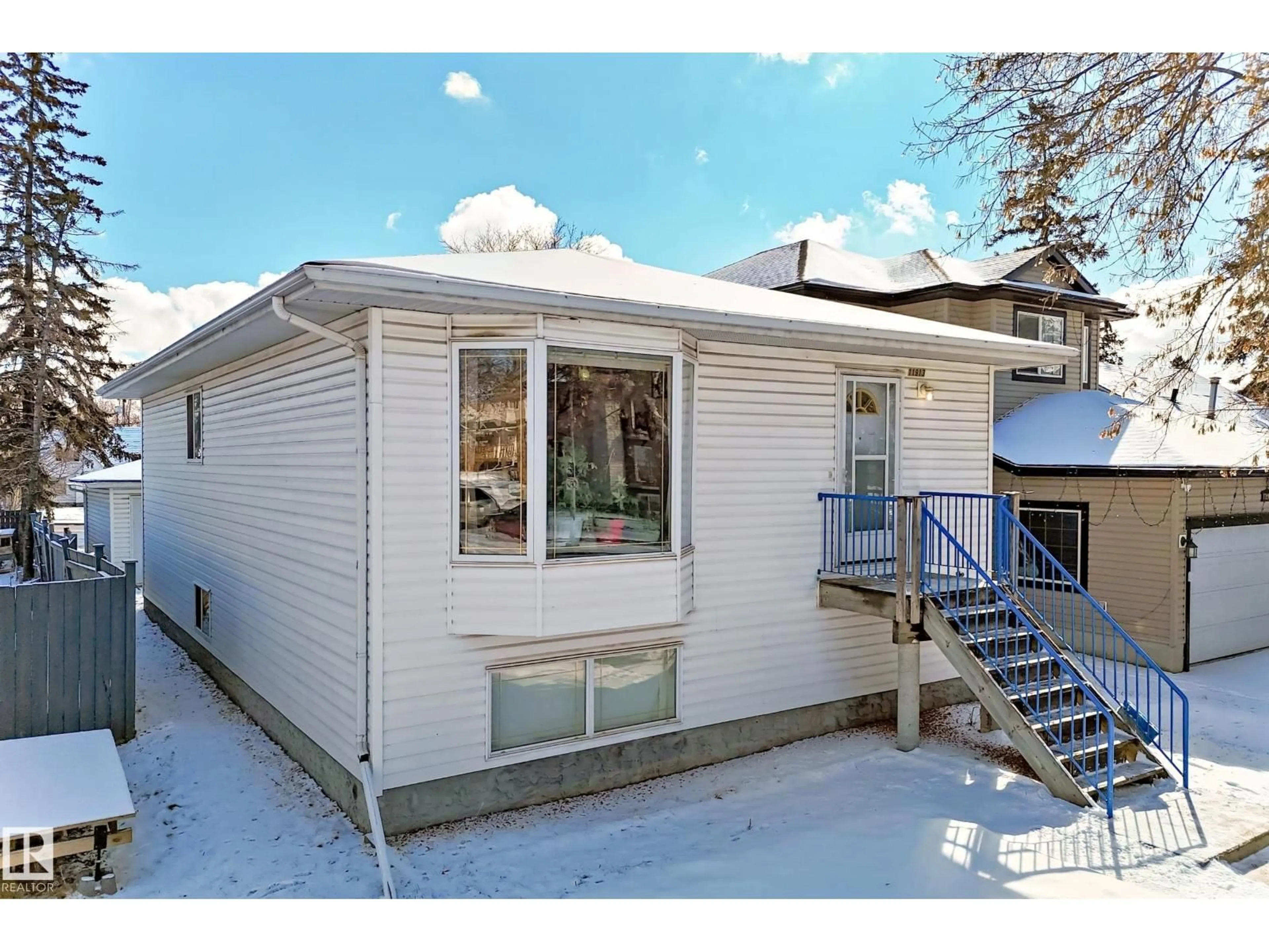 Home with vinyl exterior material, street for 11913 80 ST, Edmonton Alberta T5B2N8