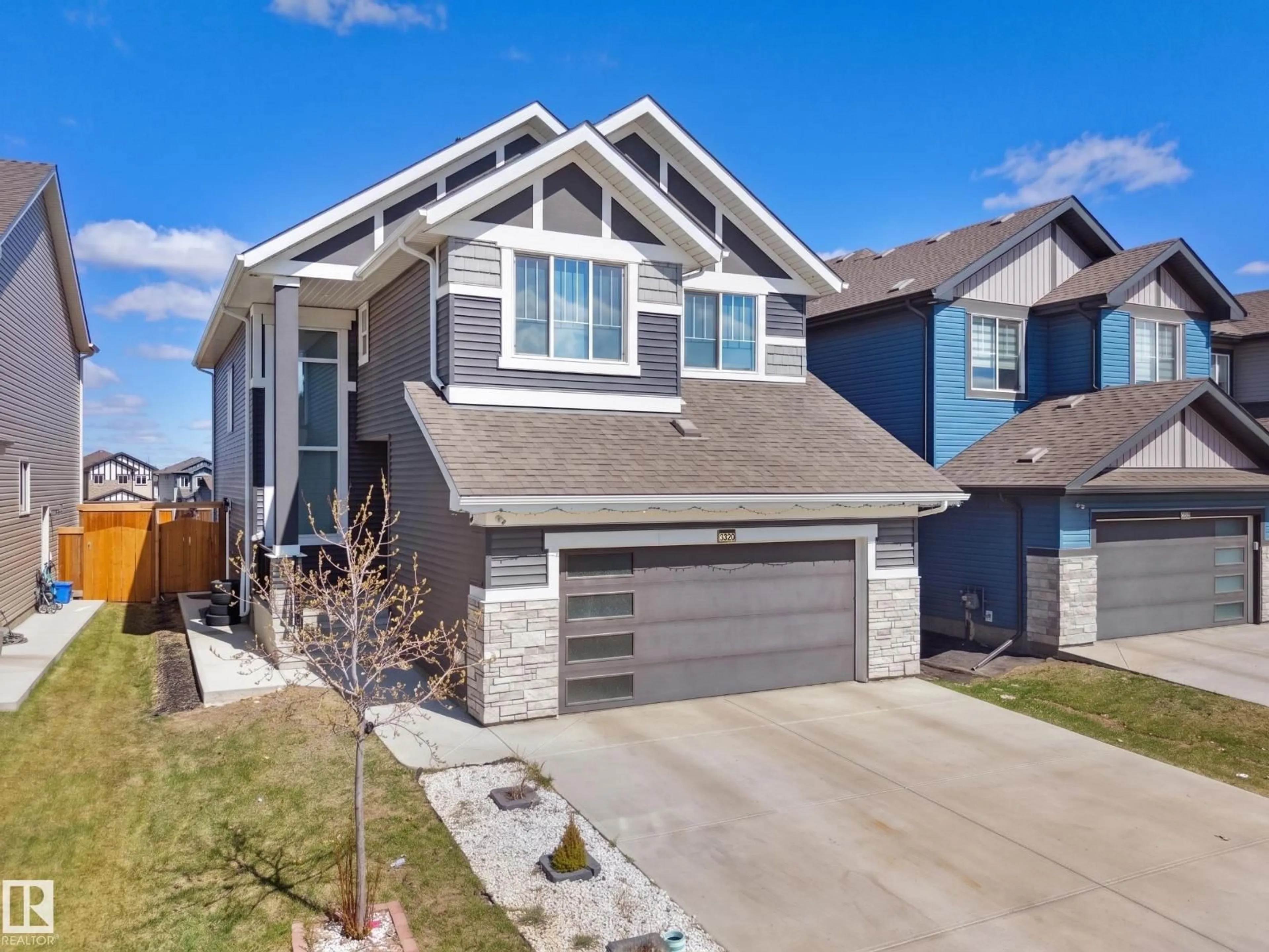 Home with vinyl exterior material, street for NW - 2520 12 AV, Edmonton Alberta T6T2M6