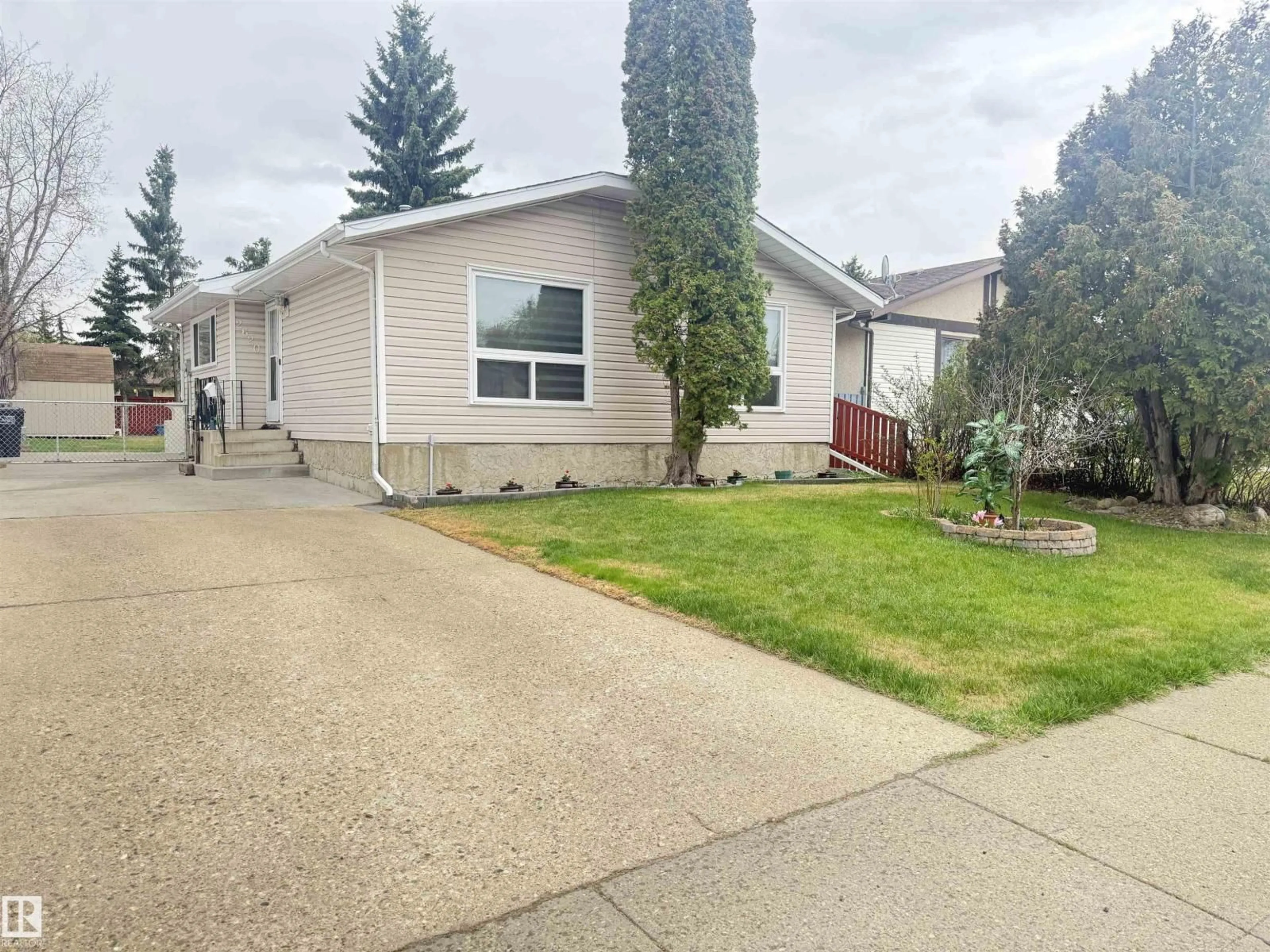 Home with vinyl exterior material, street for 2620 83 ST, Edmonton Alberta T6K2Y6