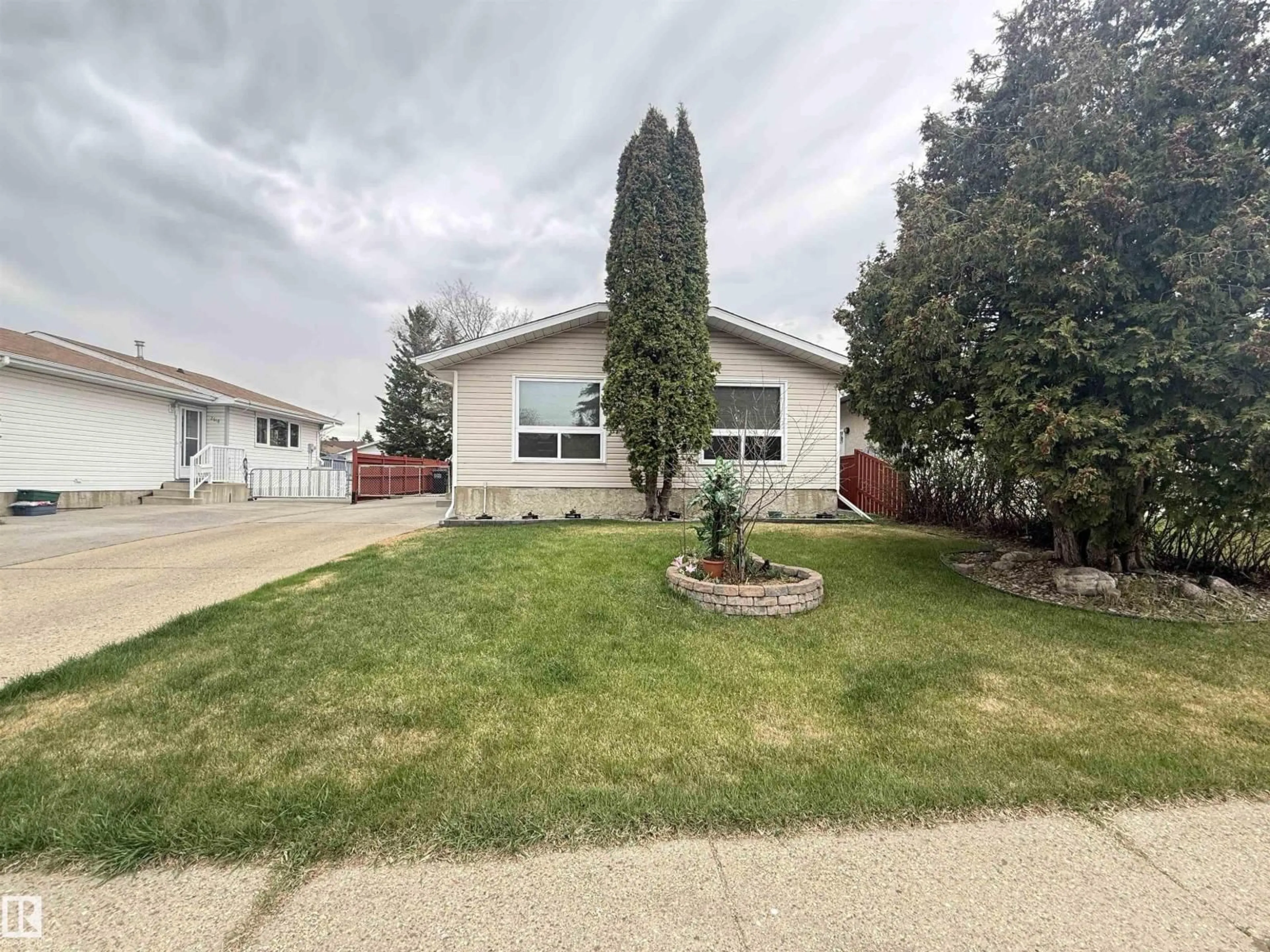 Home with vinyl exterior material, street for 2620 83 ST, Edmonton Alberta T6K2Y6