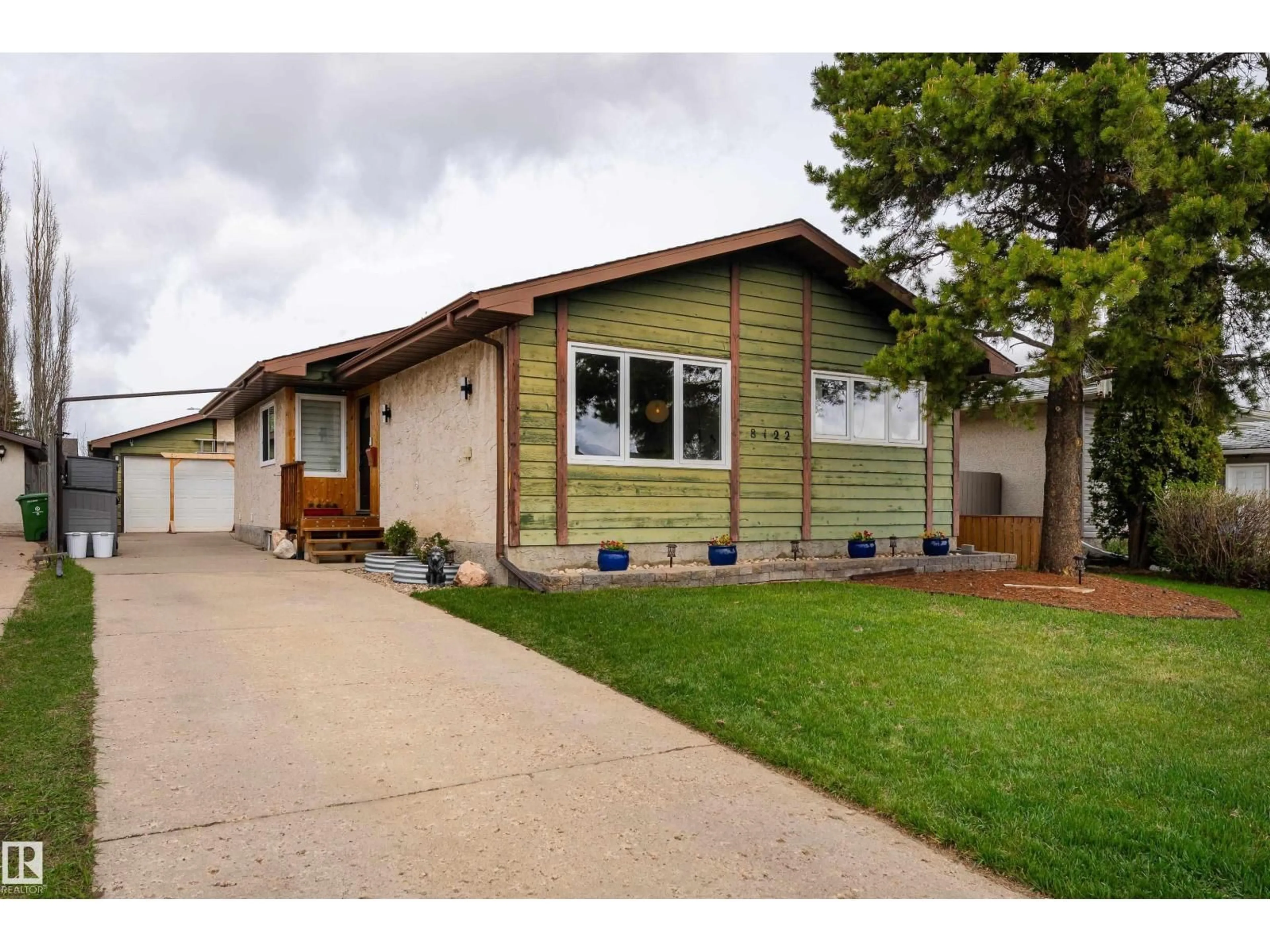 Home with vinyl exterior material, street for 8122 92A AV, Fort Saskatchewan Alberta T8L3M8