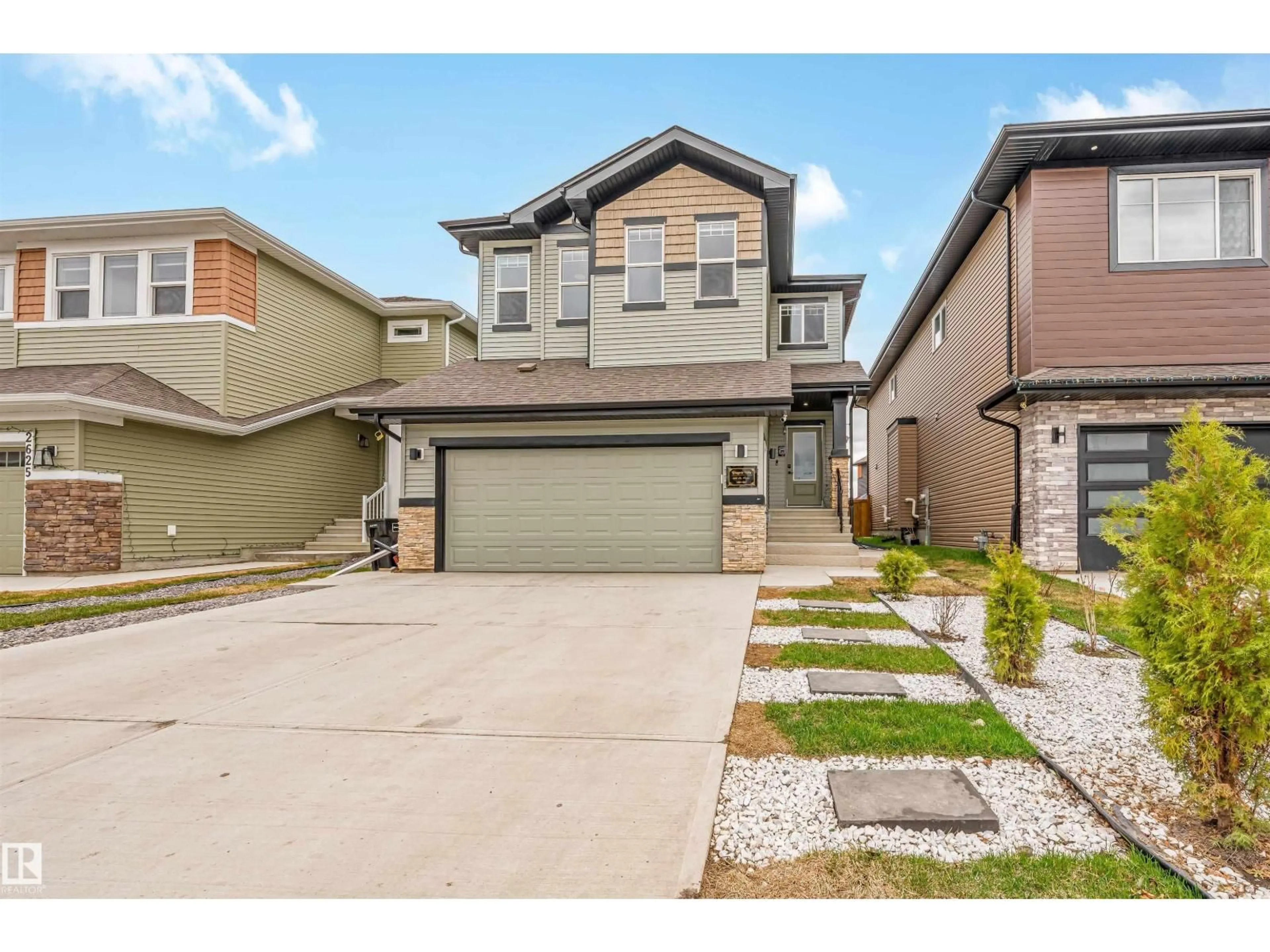 Home with vinyl exterior material, street for NW - 2629 15A AV, Edmonton Alberta T6T2T7