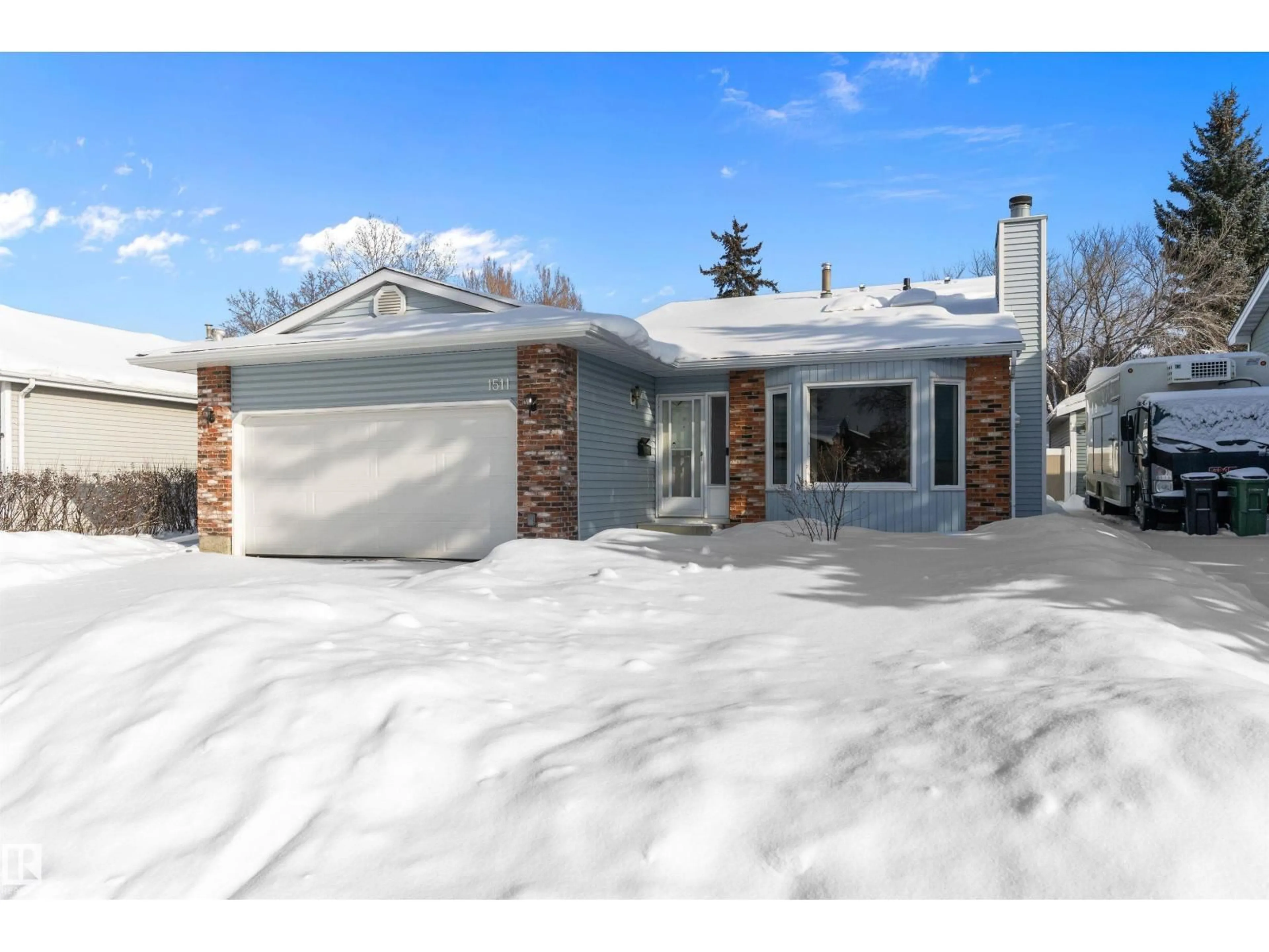 Home with vinyl exterior material, street for NW - 1511 104 ST, Edmonton Alberta T6J5T2