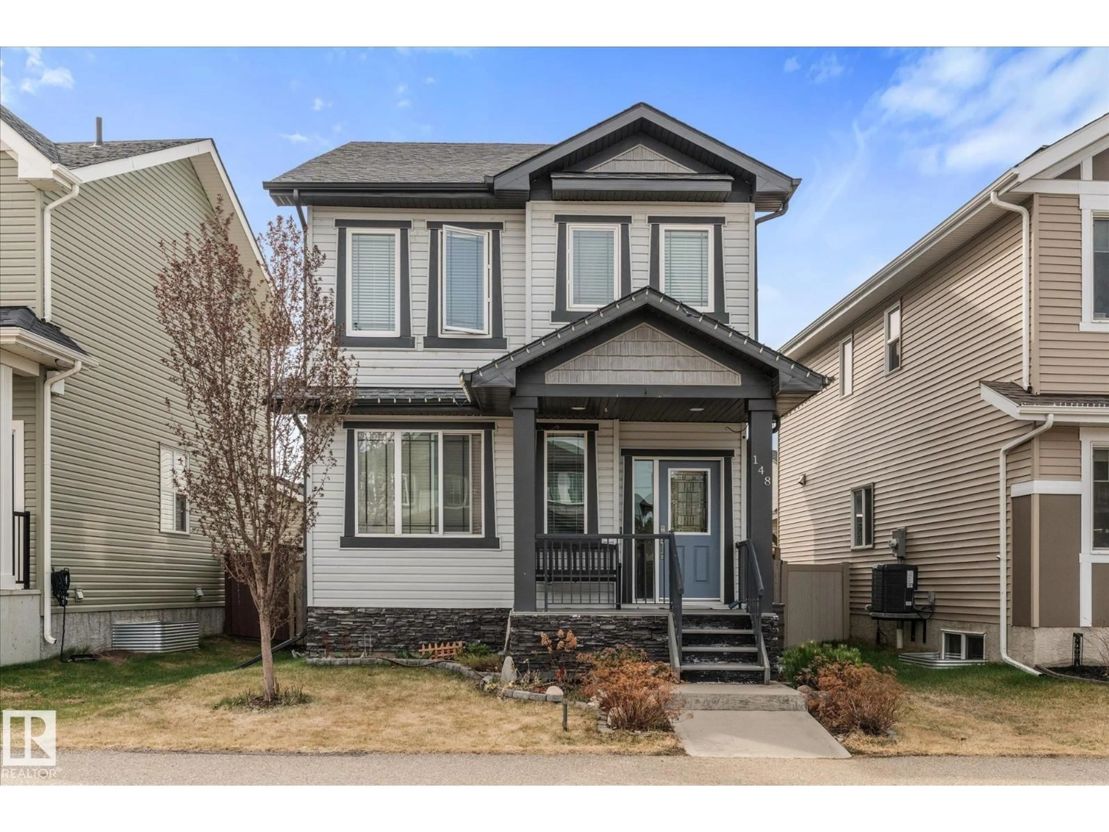 Home with vinyl exterior material, street for 148 HARVEST RIDGE DR, Spruce Grove Alberta T7X0E9