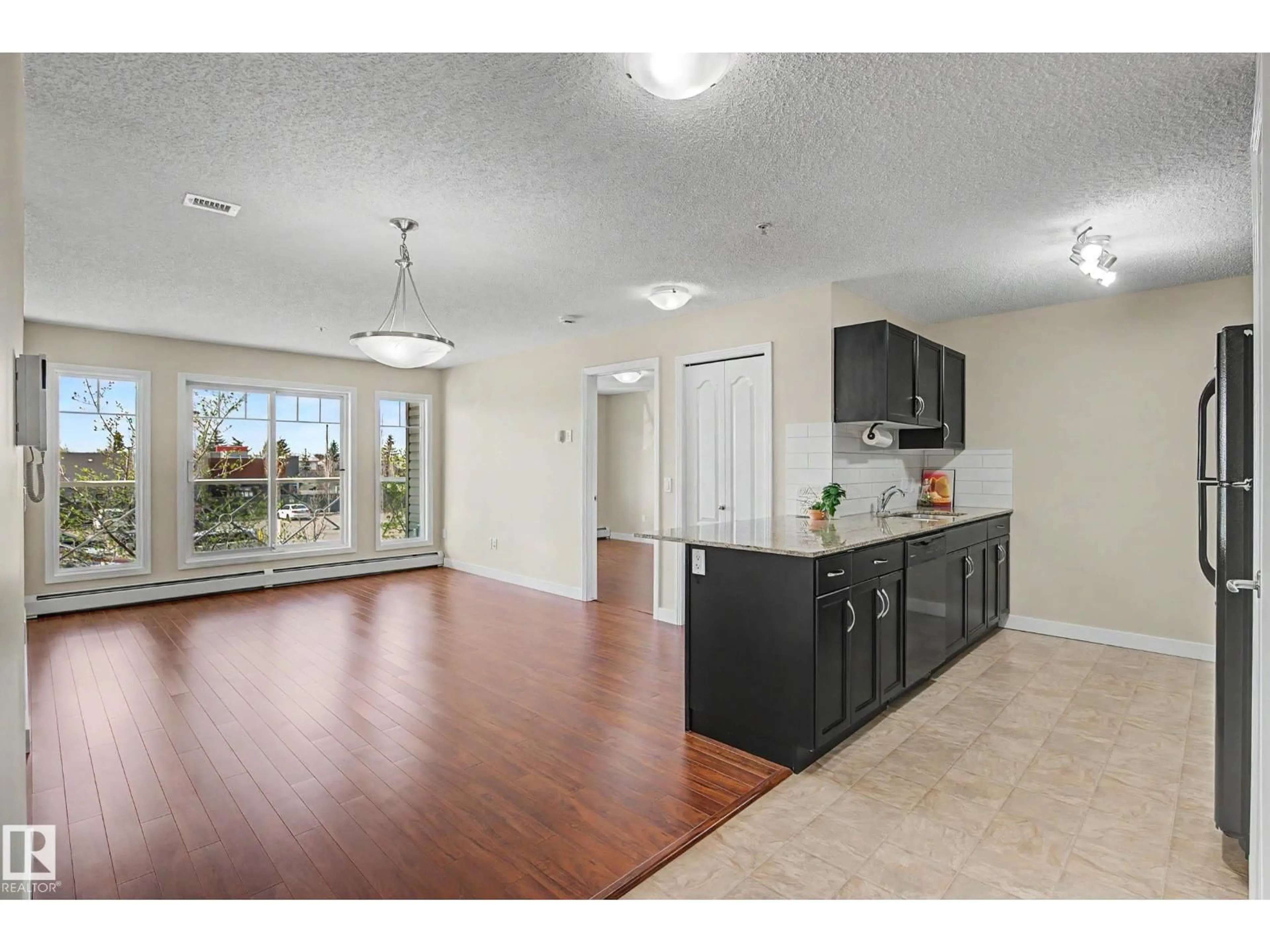 Open concept kitchen, unknown for #217 - 12650 142 AV, Edmonton Alberta T5X0J4
