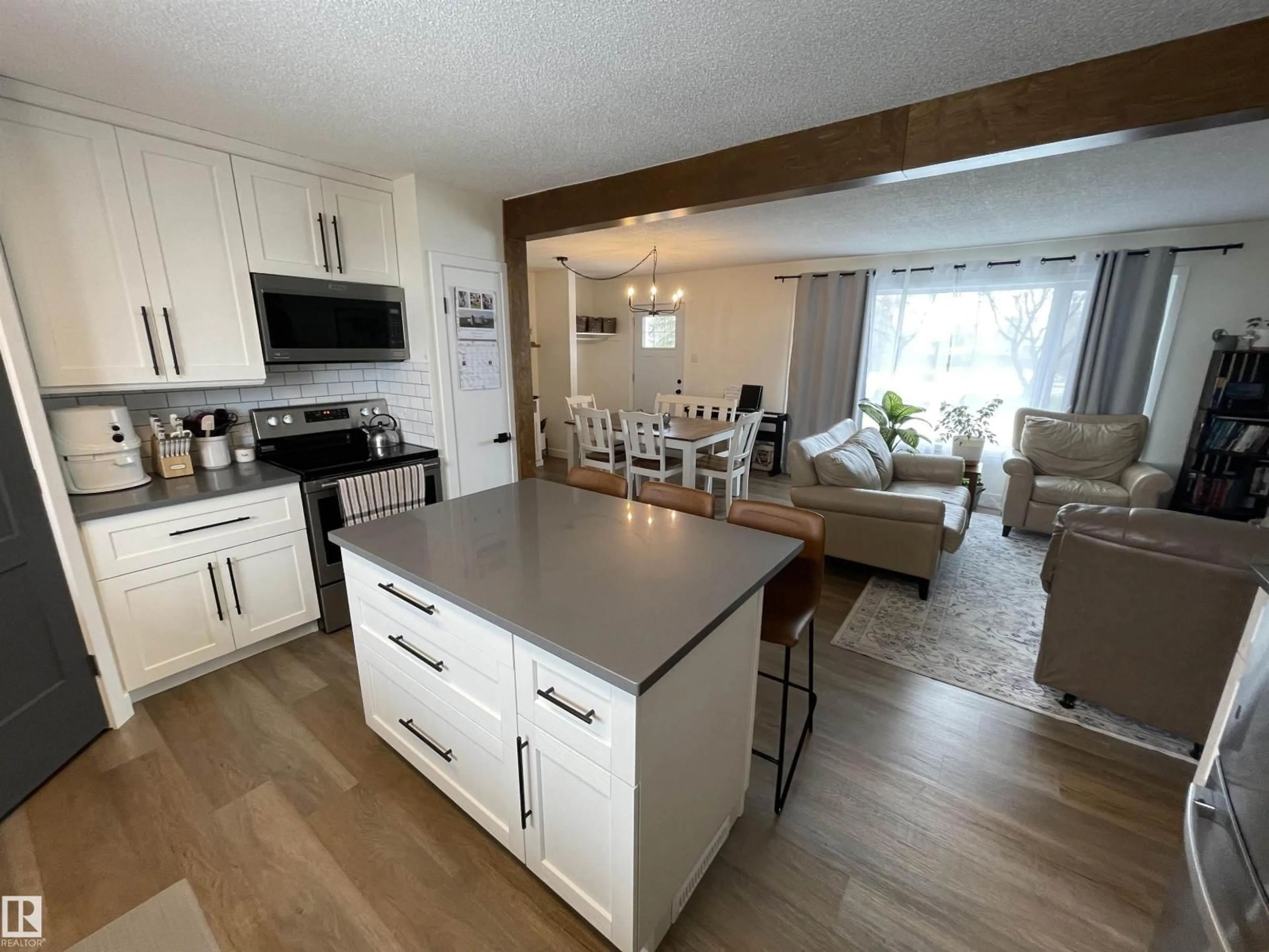 Open concept kitchen, wood/laminate floor for 5221 53 AV, St. Paul Town Alberta T0A3A1