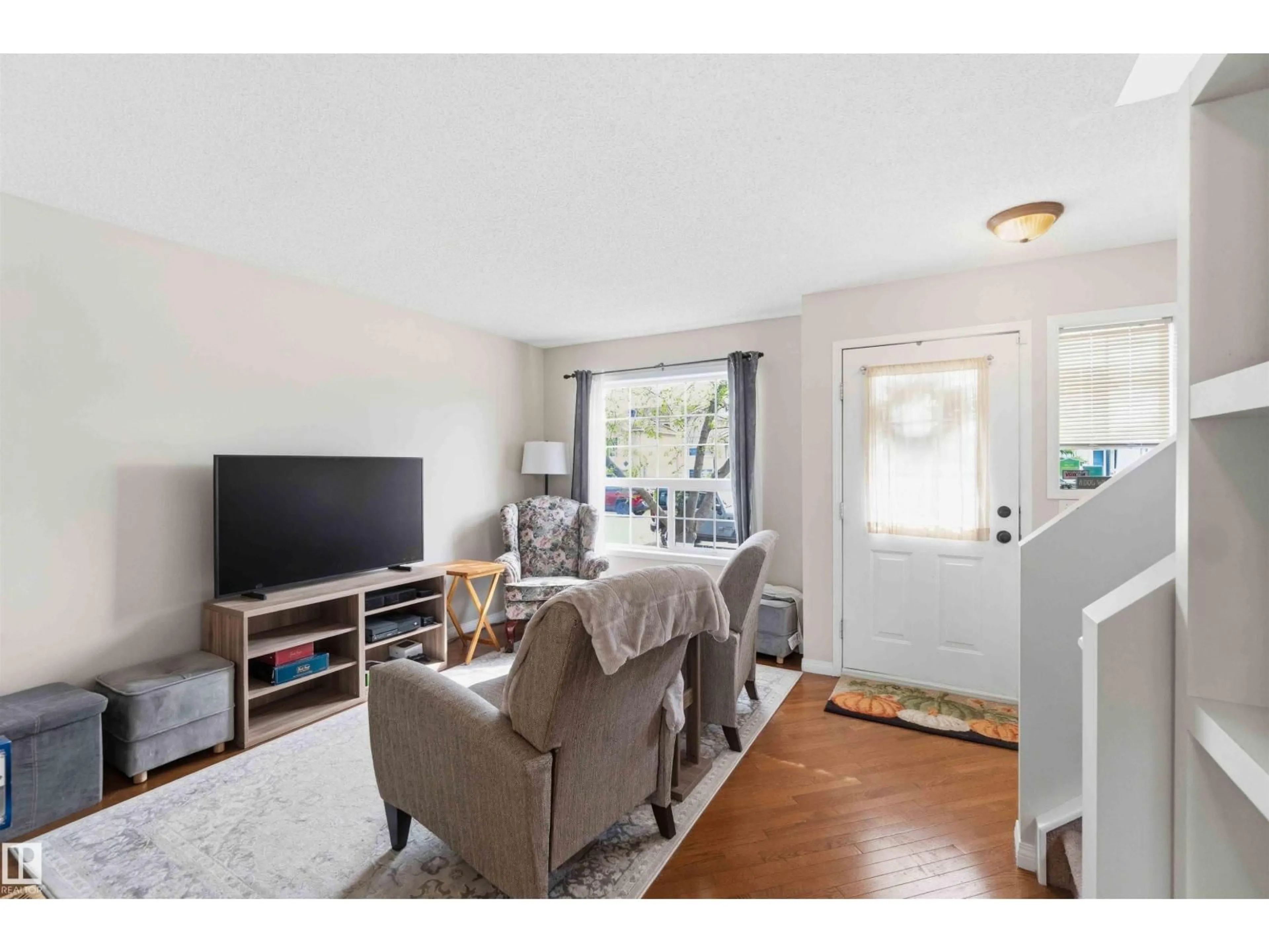 Living room with furniture, wood/laminate floor for NW - 15044 132 ST, Edmonton Alberta T6V1K8