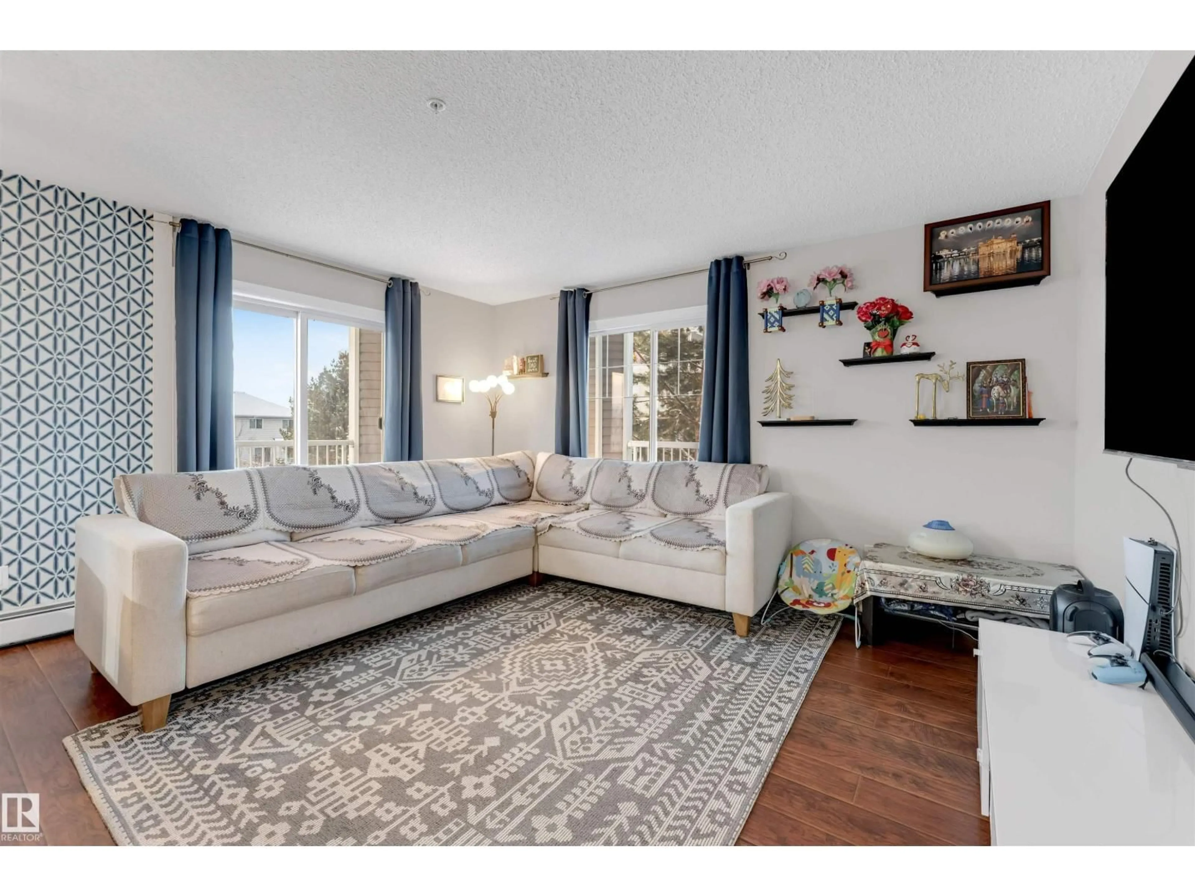 Living room with furniture, unknown for #201 - 4403 23 ST, Edmonton Alberta T6T0E4