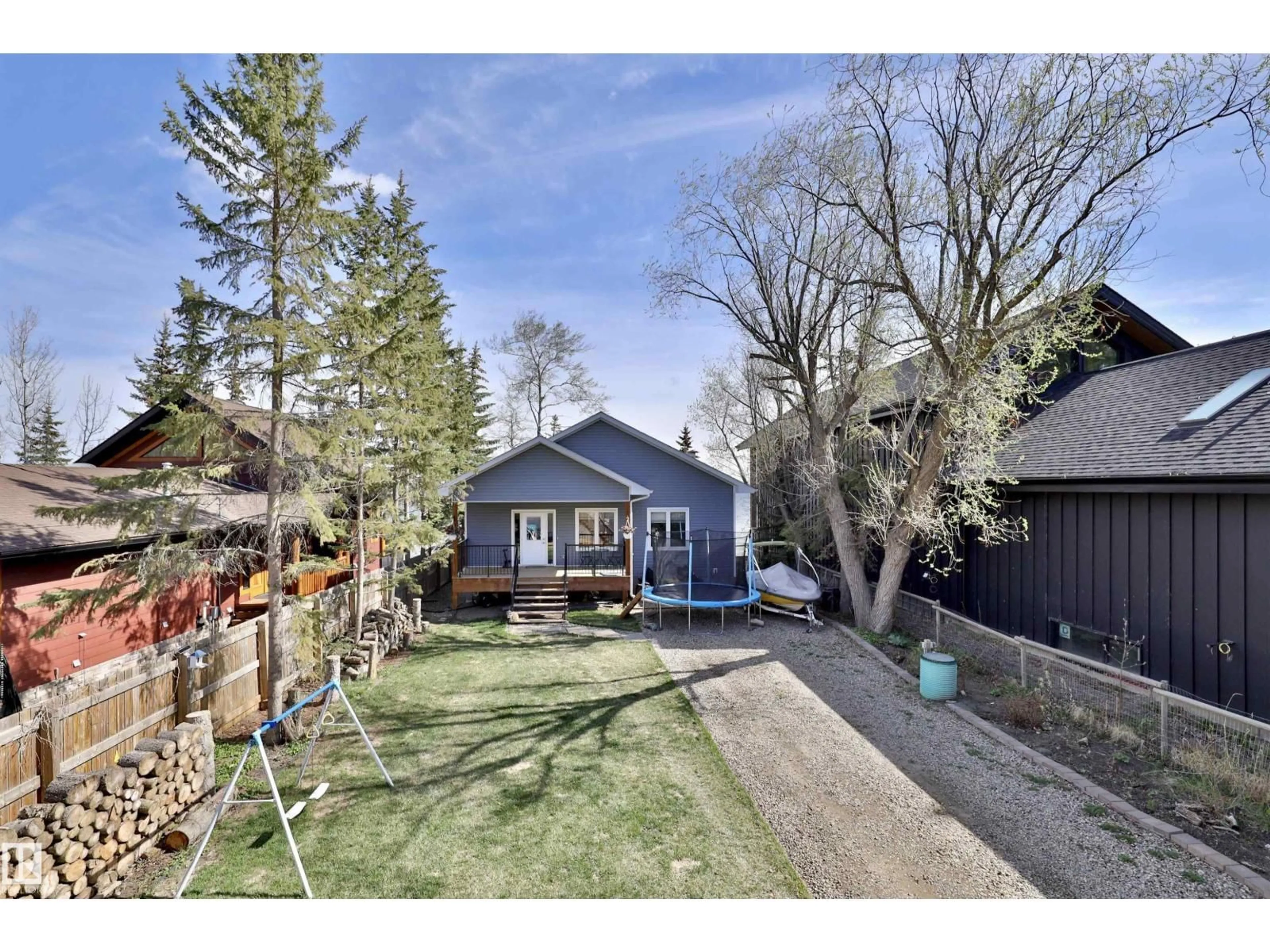A pic from outside/outdoor area/front of a property/back of a property/a pic from drone, street for 45 POPLAR BA, Rural Wetaskiwin County Alberta T0C2V0