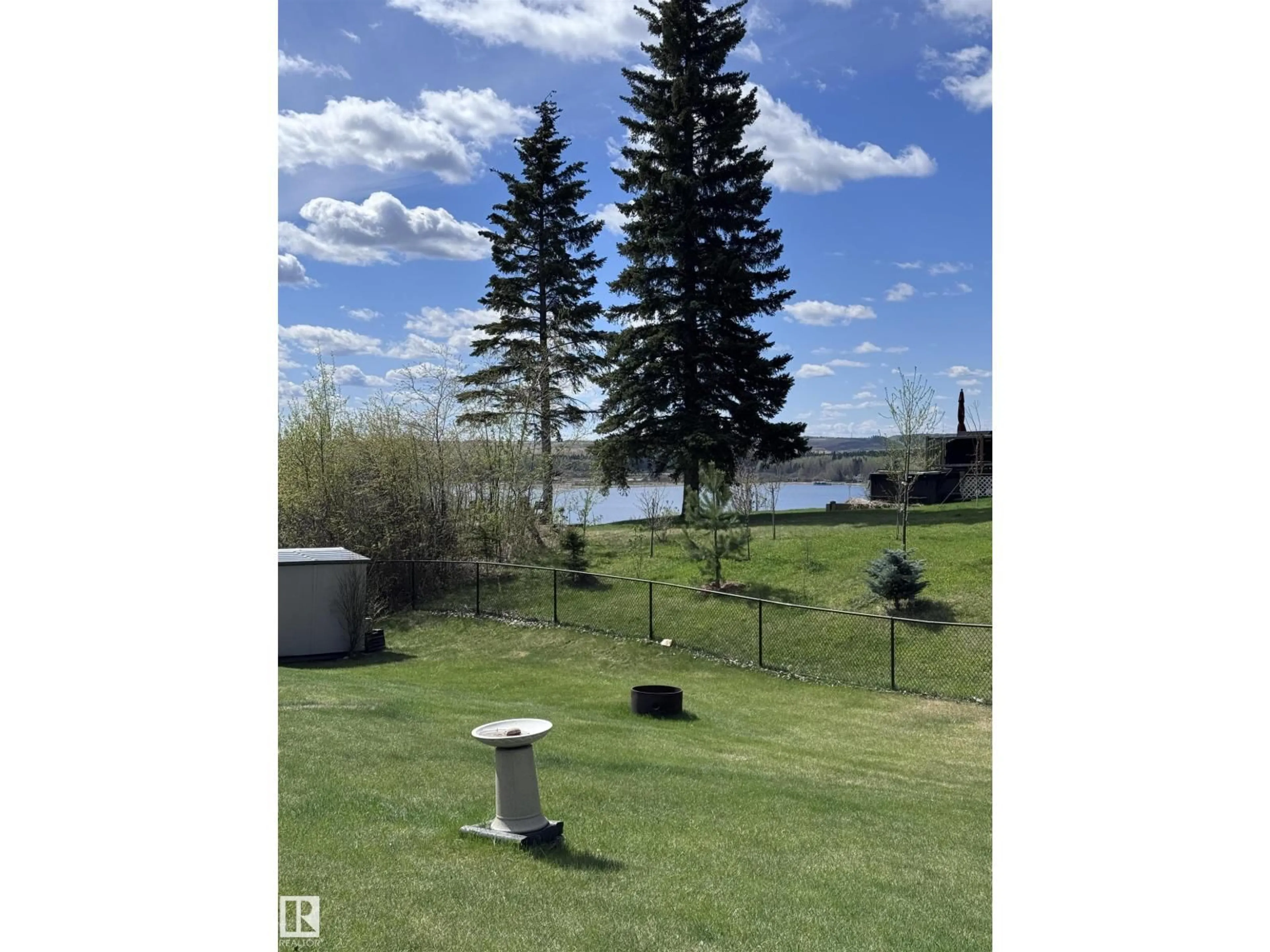 A pic from outside/outdoor area/front of a property/back of a property/a pic from drone, water/lake/river/ocean view for 53117 - 7 HWY 31, Rural Parkland County Alberta T0E2B0