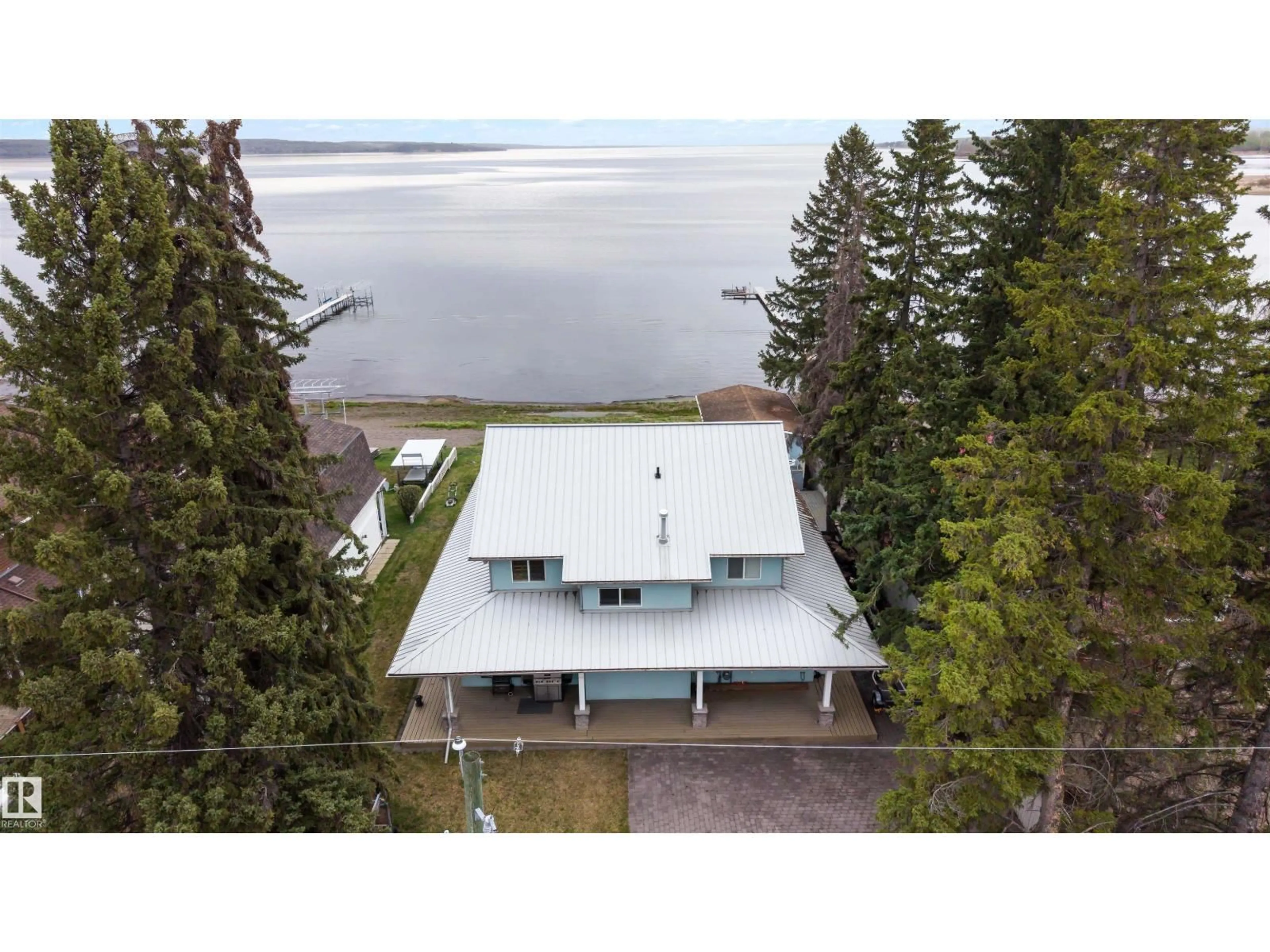 A pic from outside/outdoor area/front of a property/back of a property/a pic from drone, water/lake/river/ocean view for 621 1 AV S, Rural Parkland County Alberta T0E2B0