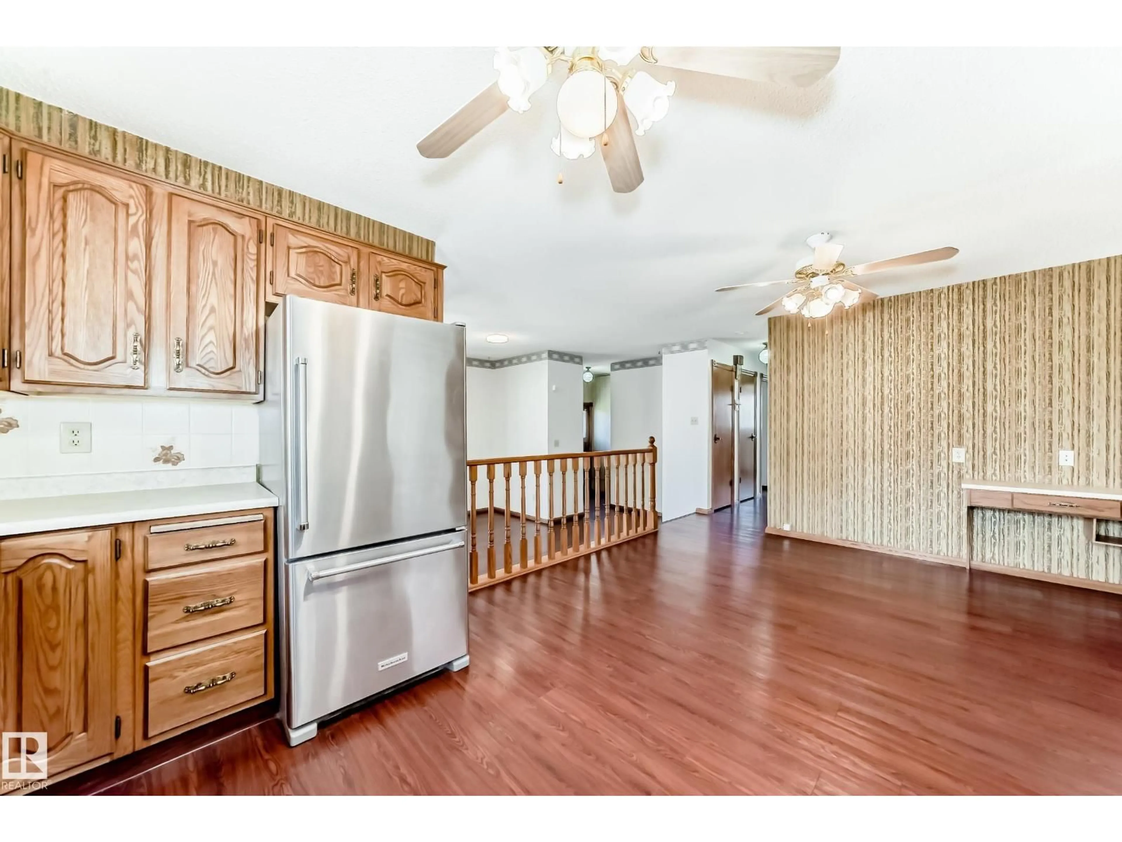 Open concept kitchen, wood/laminate floor for NW - 12245 55 ST, Edmonton Alberta T5W3R5