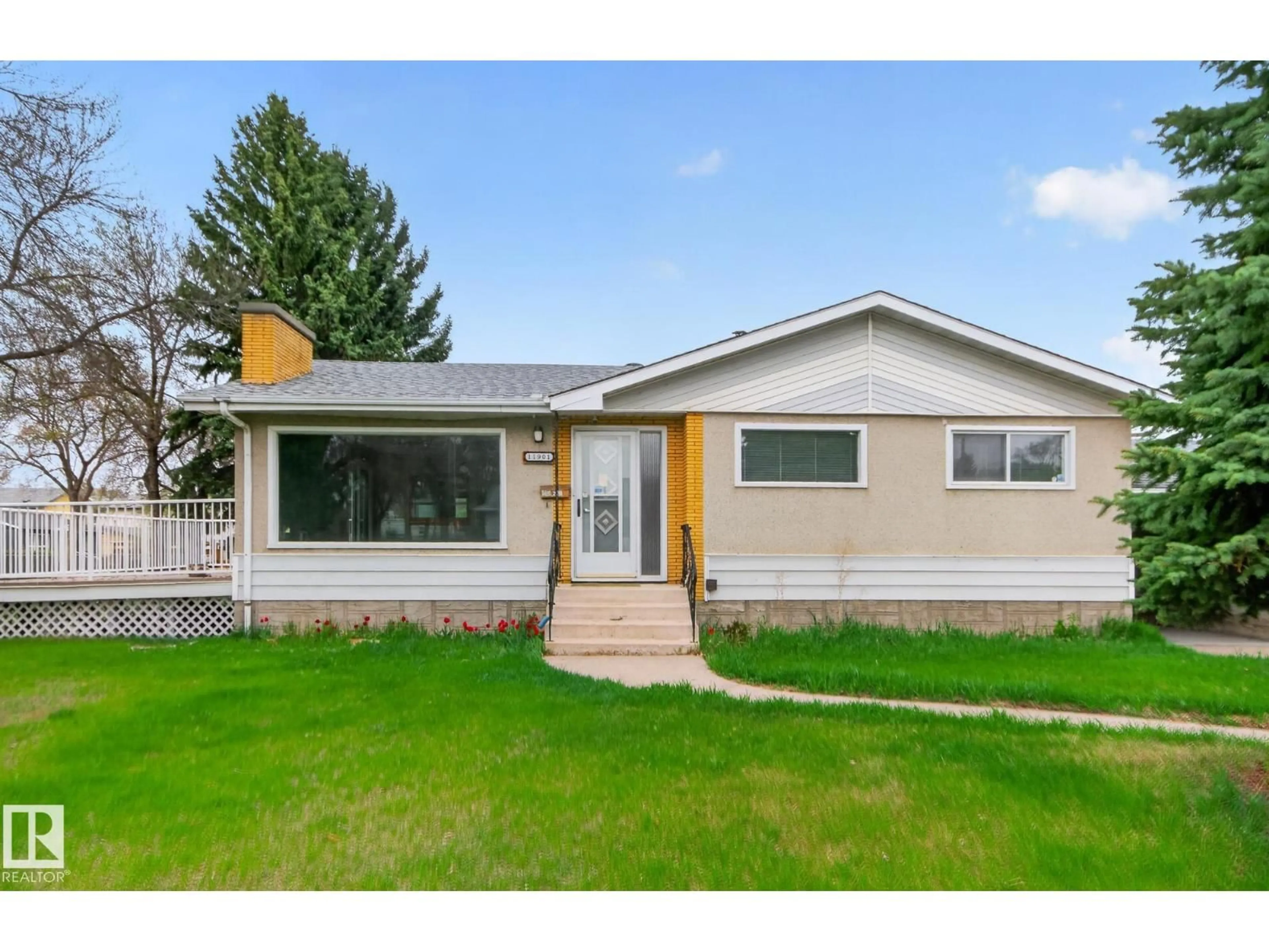 Home with vinyl exterior material, street for 11901 42 ST, Edmonton Alberta T5W2N5