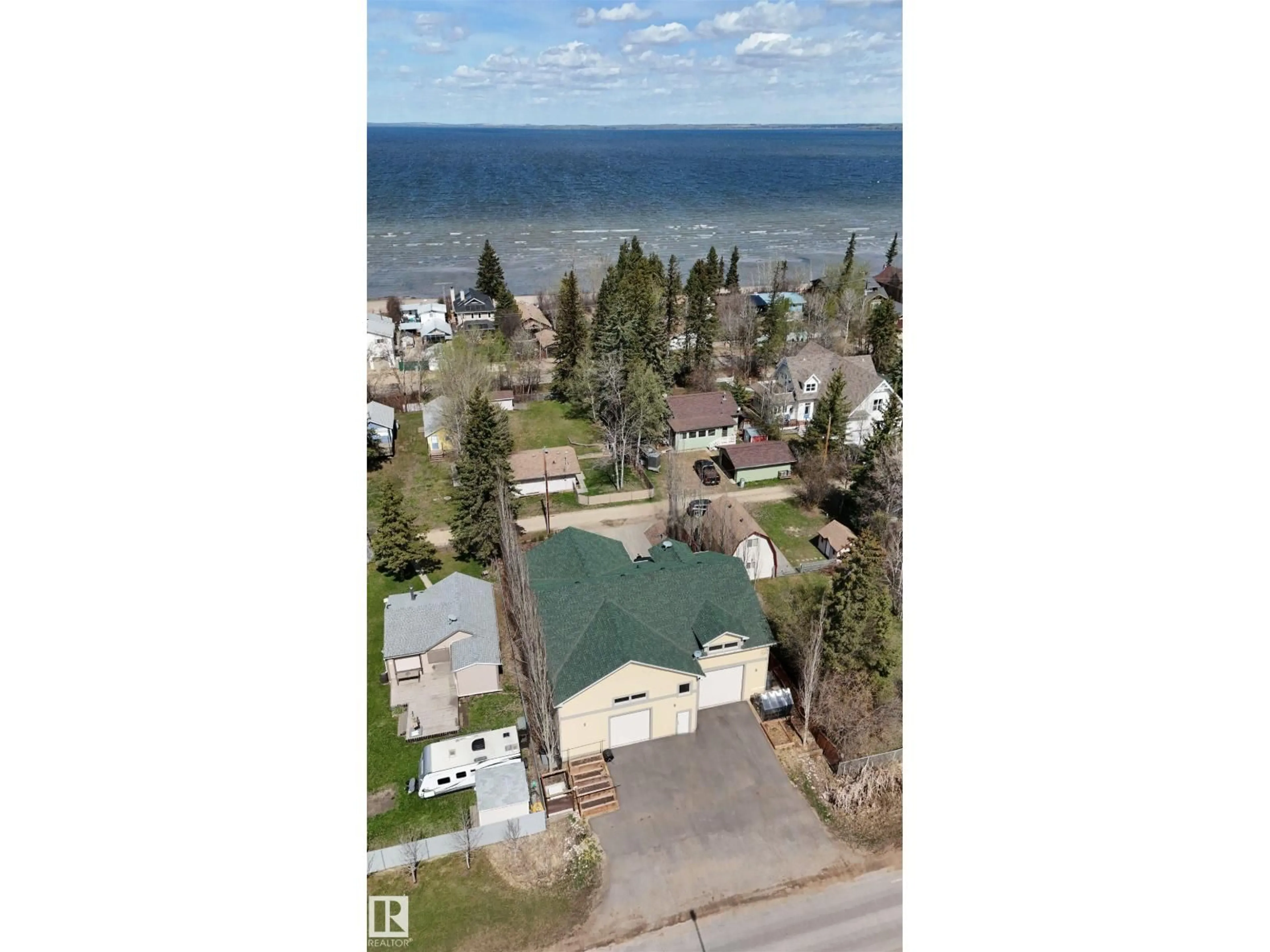 A pic from outside/outdoor area/front of a property/back of a property/a pic from drone, water/lake/river/ocean view for 1017 2AVE, Rural Wetaskiwin County Alberta T0C1X0