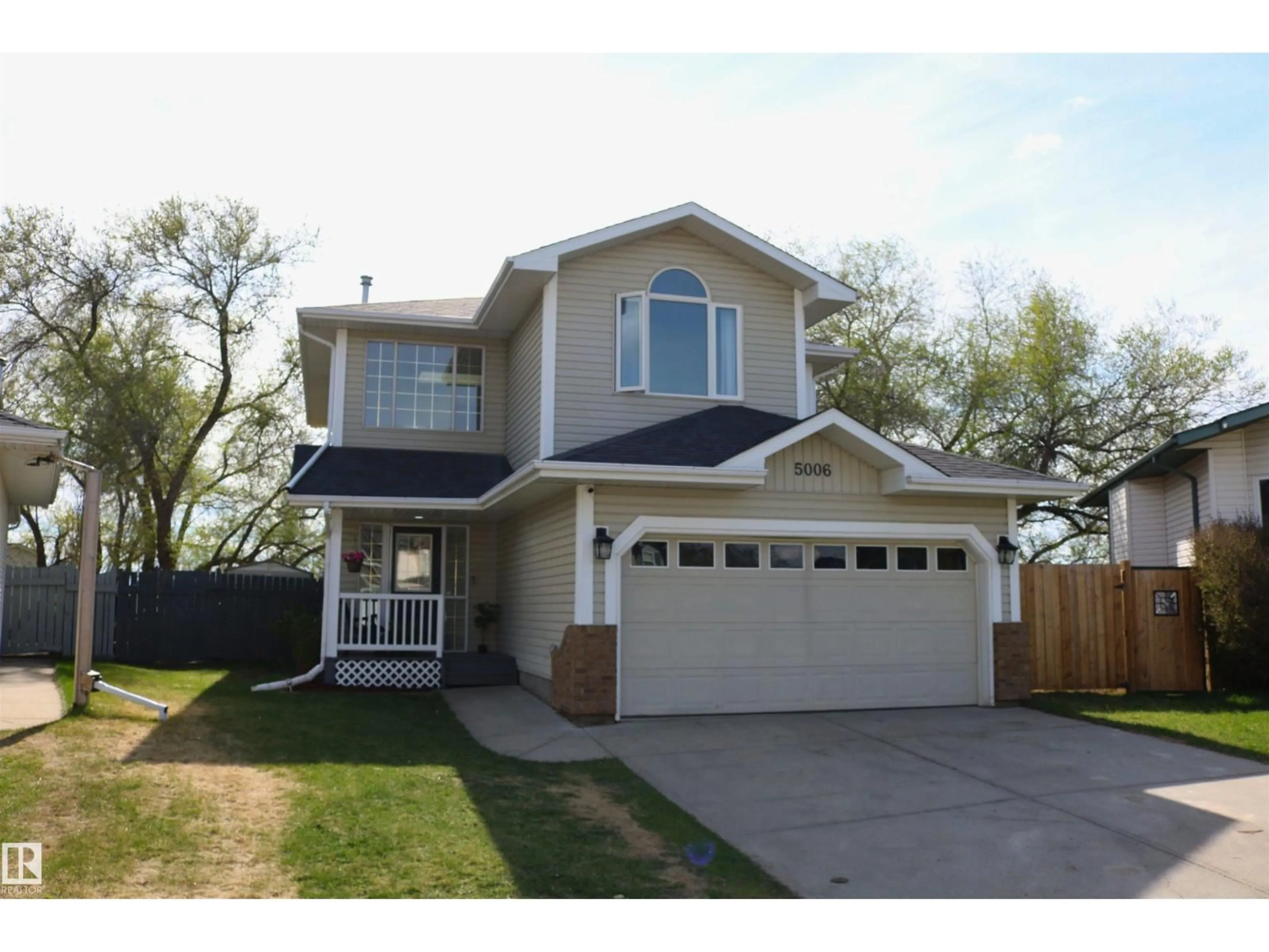 Home with vinyl exterior material, street for 5006 59, Beaumont Alberta T4X1B7