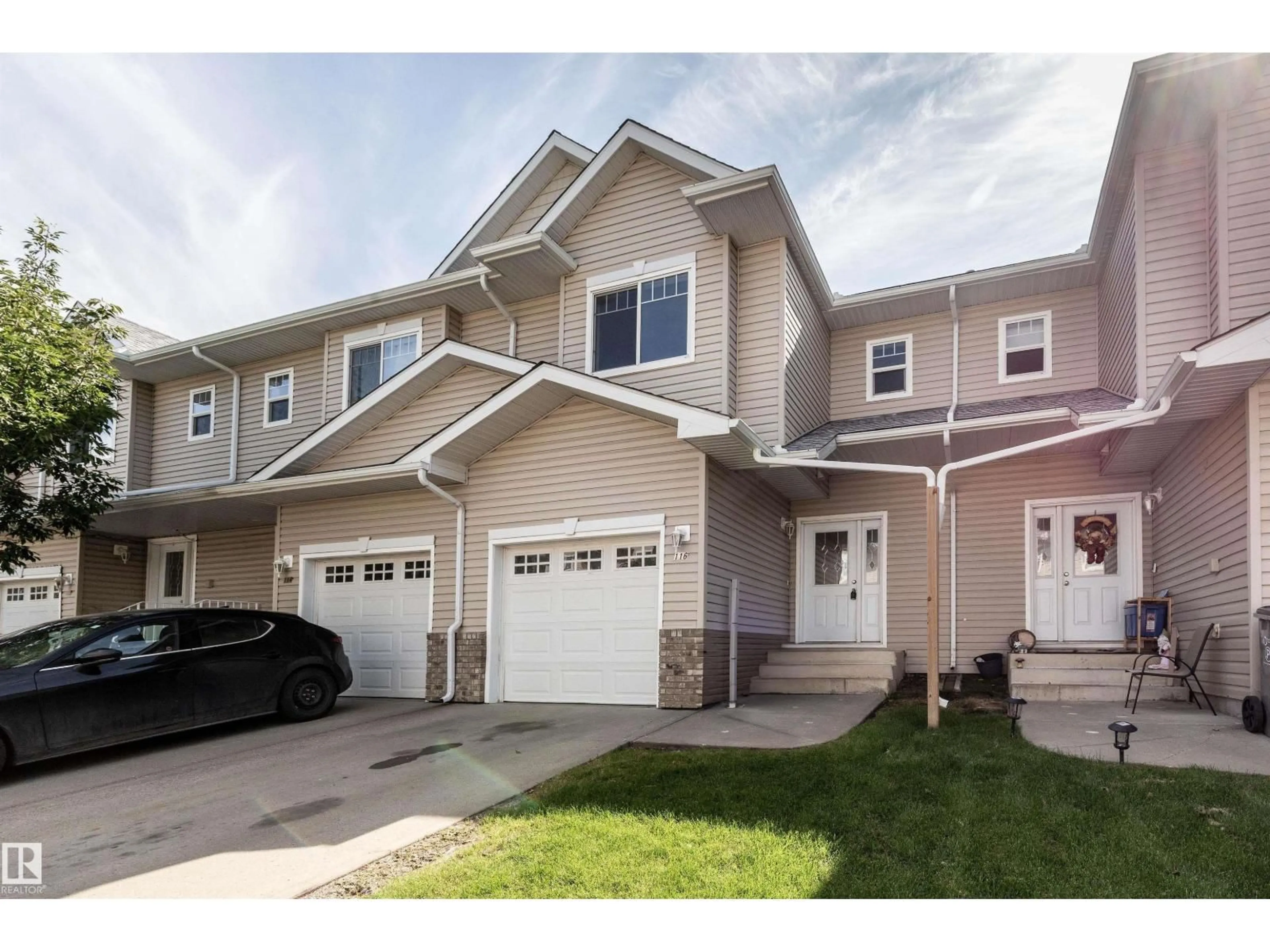 Home with vinyl exterior material, street for 116 5001 62 ST, Beaumont Alberta T4X0C7