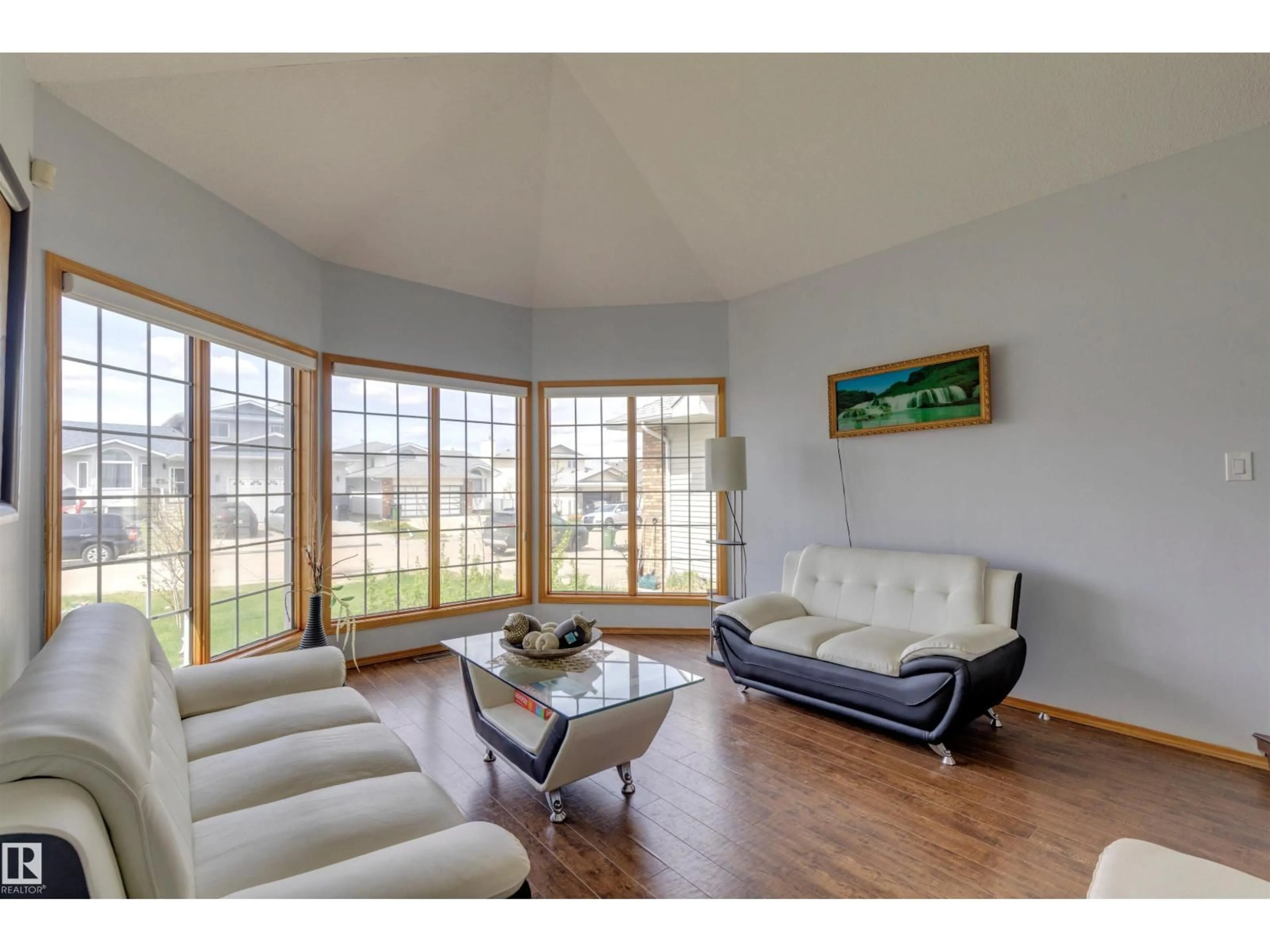 Living room with furniture, wood/laminate floor for NW - 15411 67A ST, Edmonton Alberta T5Z2W8