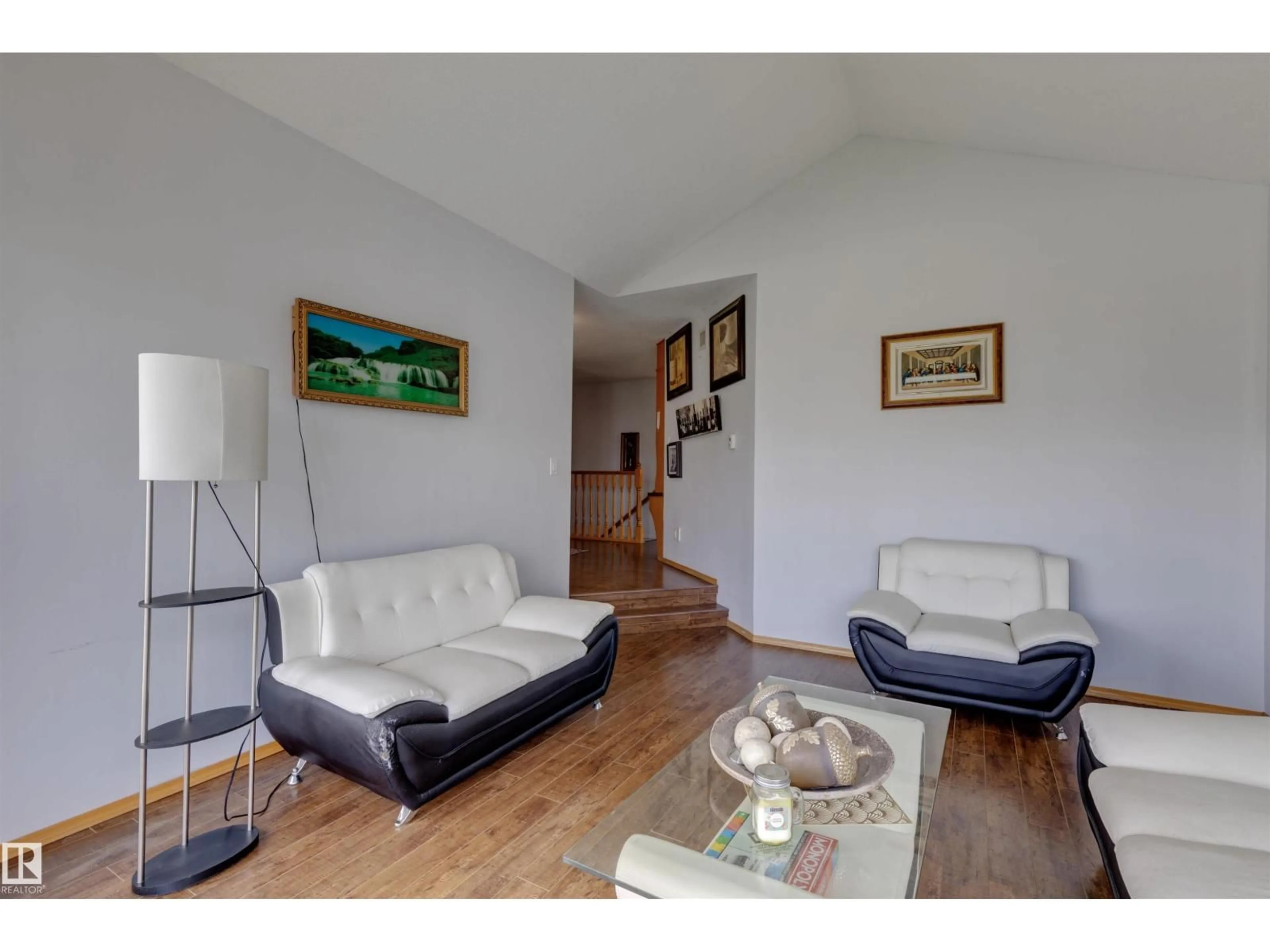 Living room with furniture, wood/laminate floor for NW - 15411 67A ST, Edmonton Alberta T5Z2W8