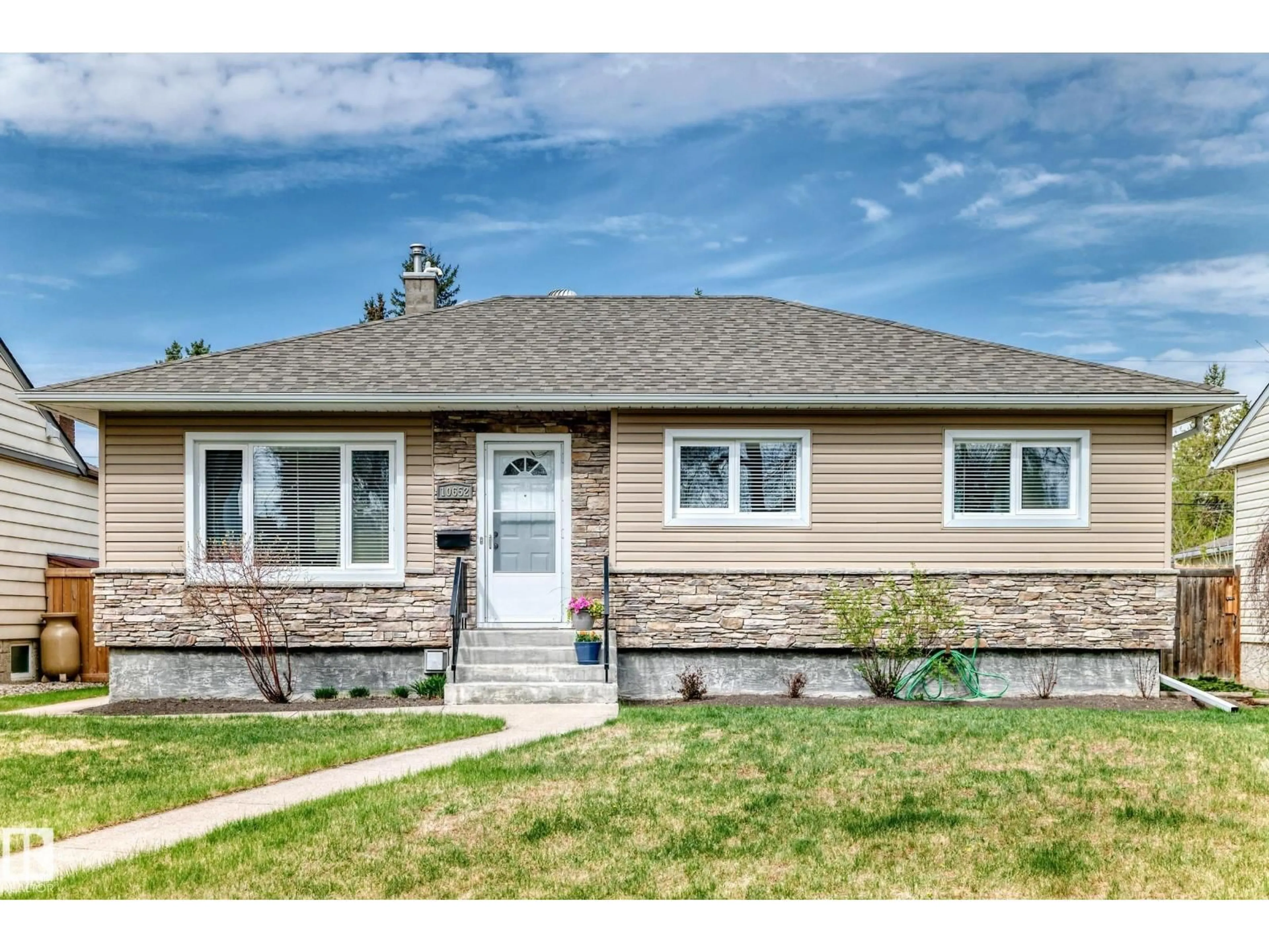 Home with vinyl exterior material, street for NW - 10652 144 ST, Edmonton Alberta T5N2V6