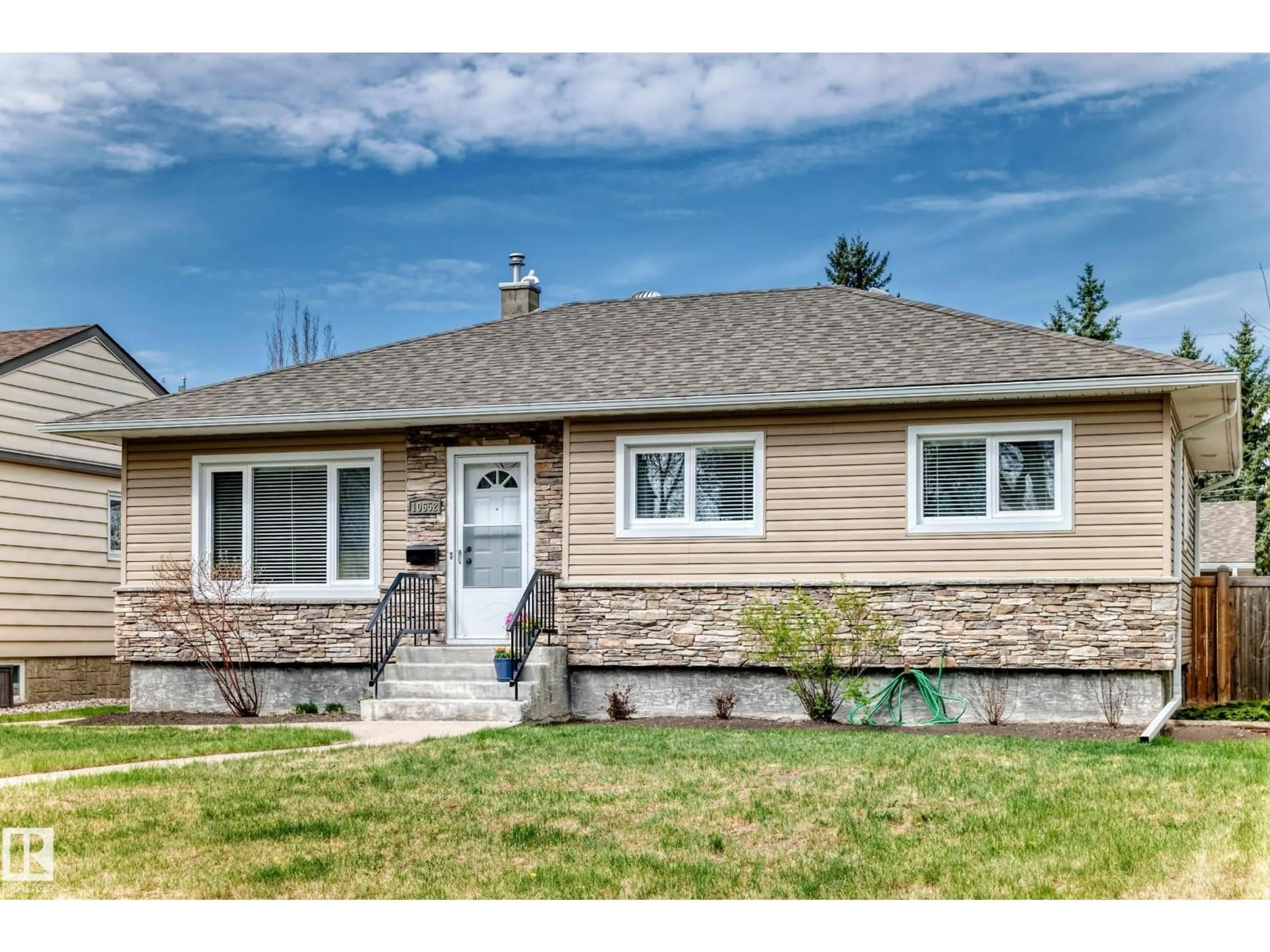 Home with vinyl exterior material, street for NW - 10652 144 ST, Edmonton Alberta T5N2V6