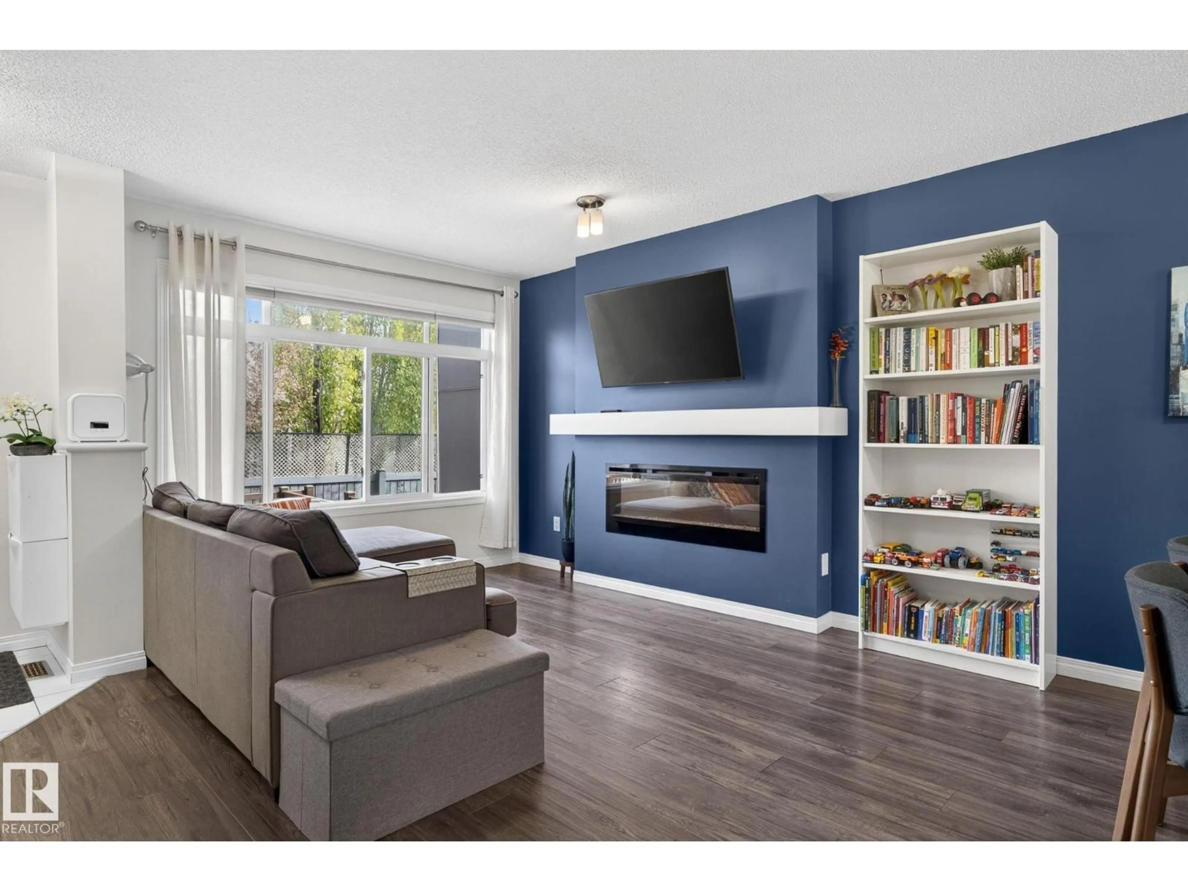 Living room with furniture, wood/laminate floor for #16 - 7503 GETTY GATE GA, Edmonton Alberta T5T4S8