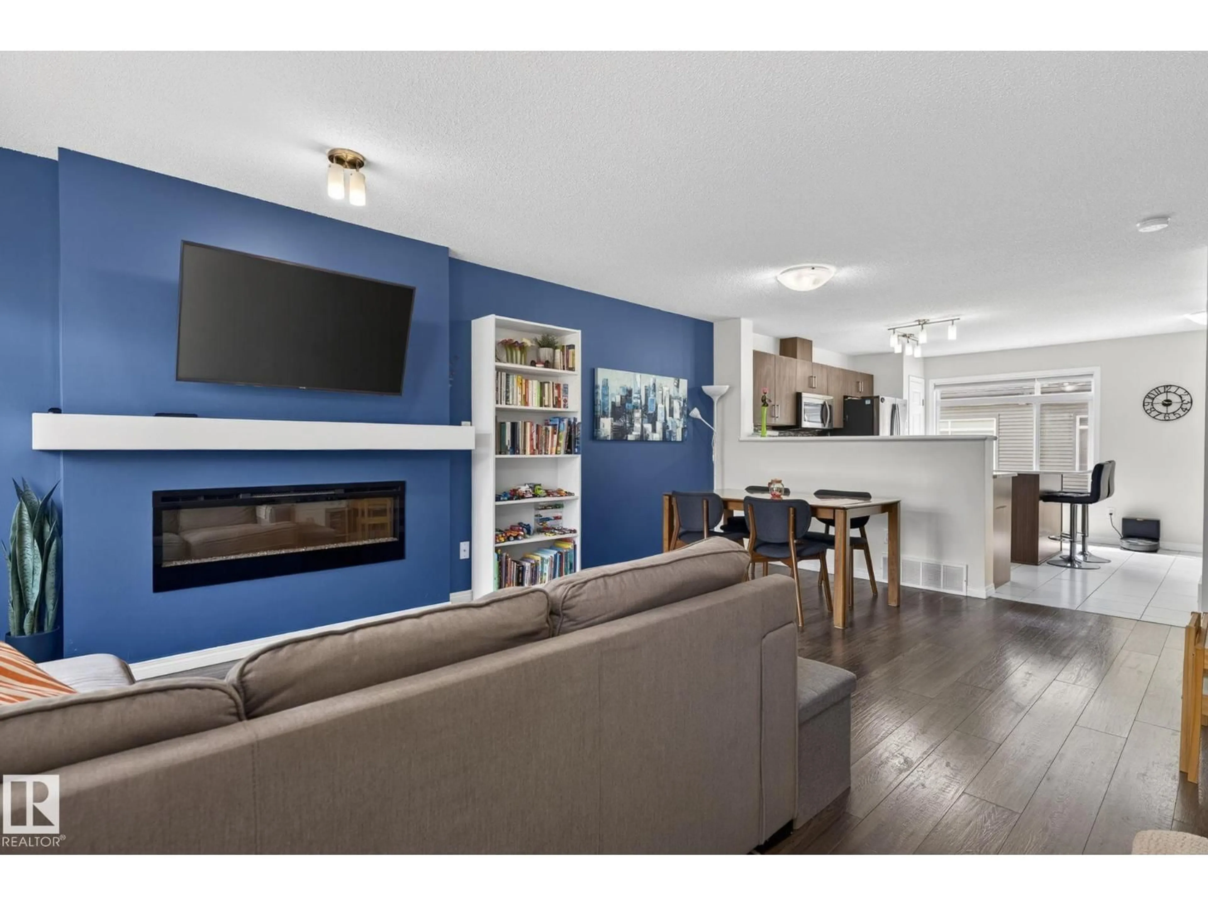 Living room with furniture, wood/laminate floor for #16 - 7503 GETTY GATE GA, Edmonton Alberta T5T4S8