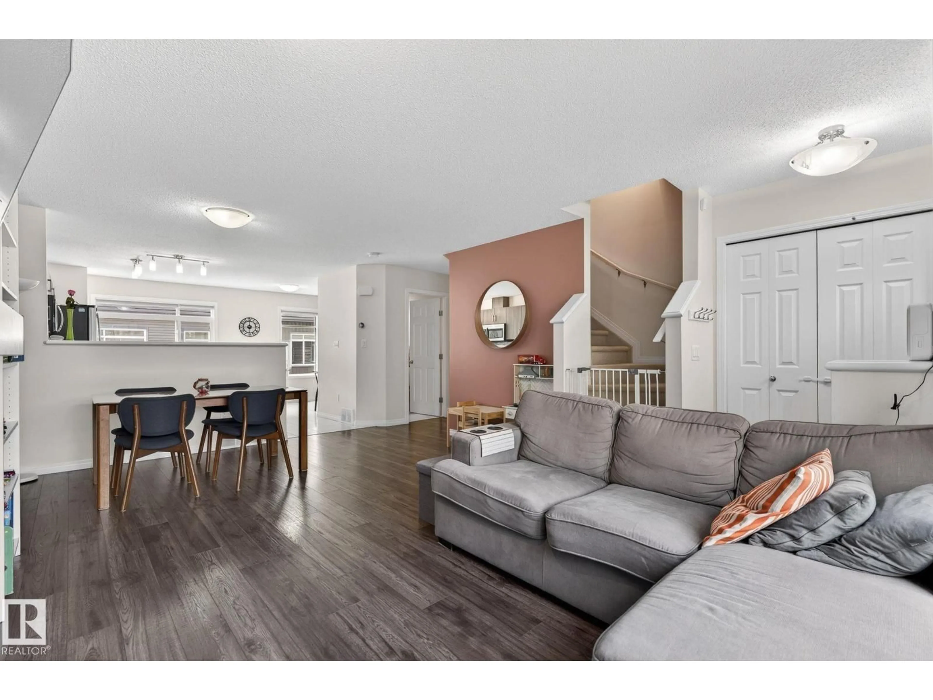 Living room with furniture, wood/laminate floor for #16 - 7503 GETTY GATE GA, Edmonton Alberta T5T4S8
