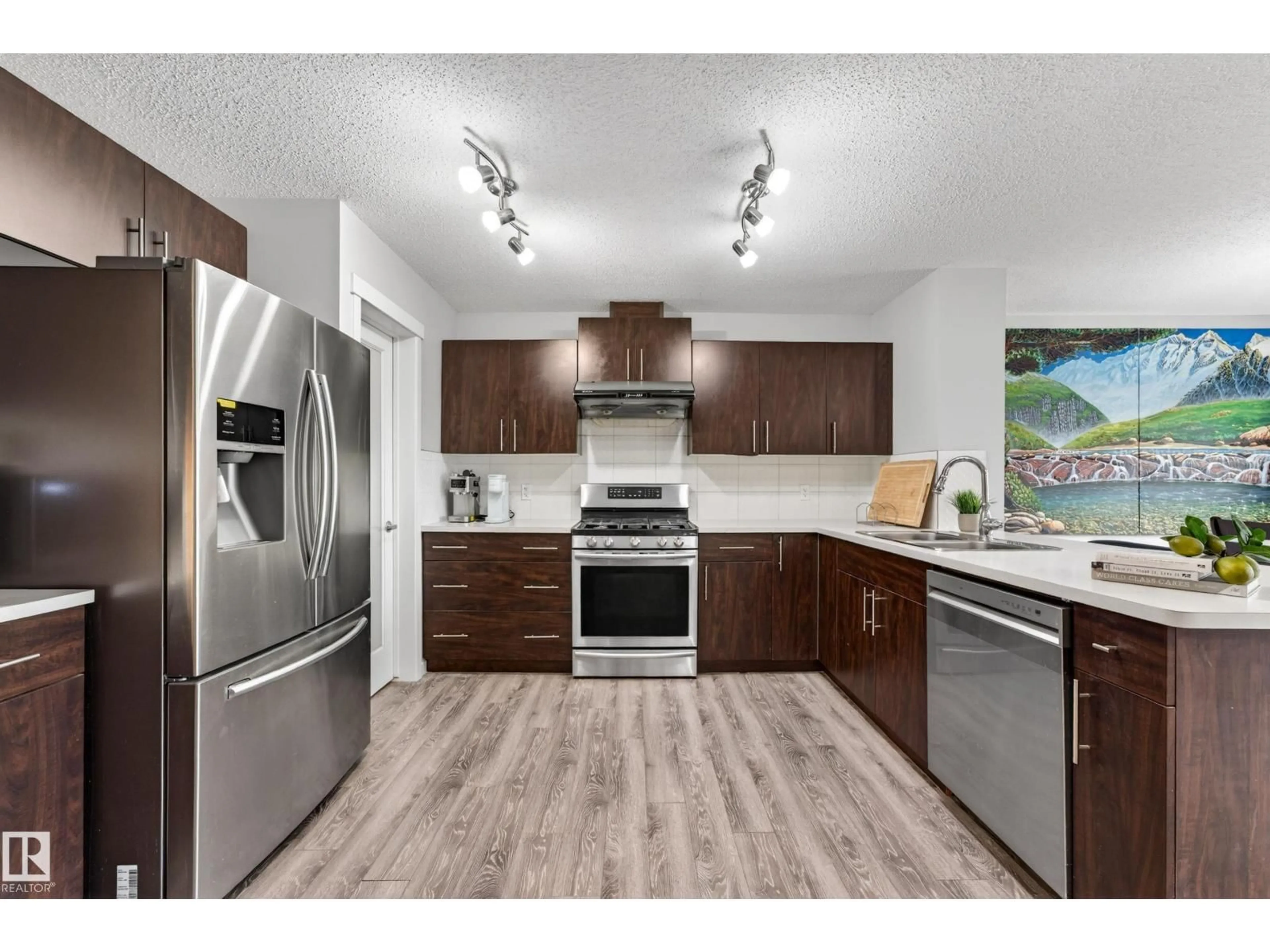 Open concept kitchen, wood/laminate floor for SW - 4371 ANNETT CM, Edmonton Alberta T6W2V6