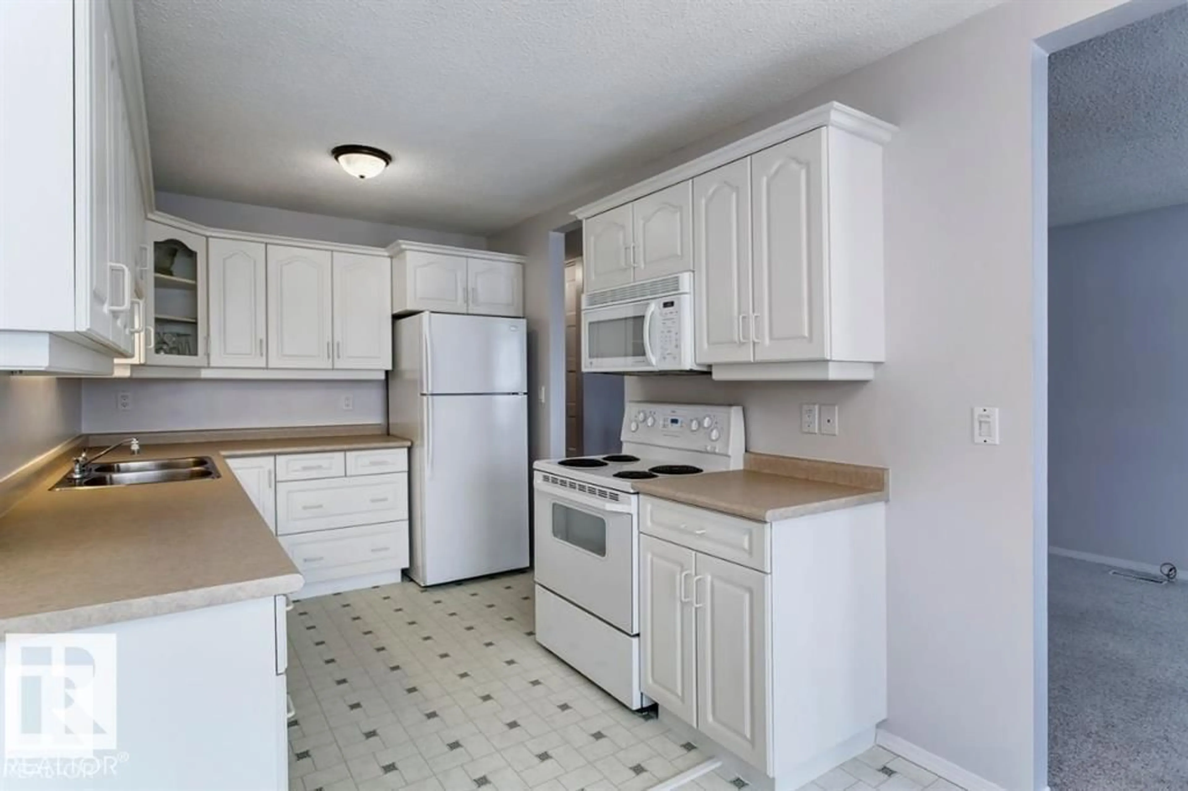 Standard kitchen, unknown for 10688 BEAUMARIS RD, Edmonton Alberta T5X3N4