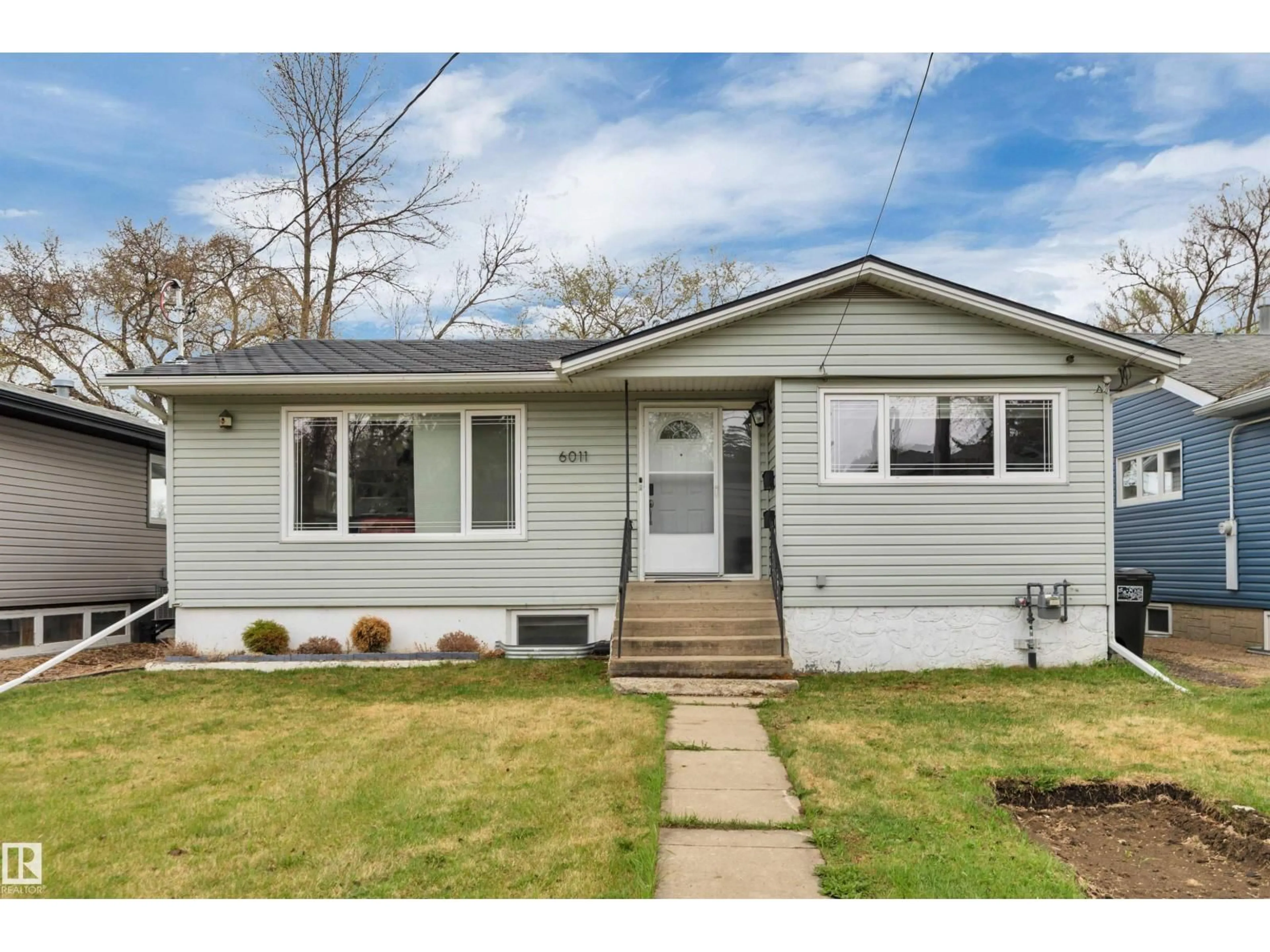 Home with vinyl exterior material, street for 6011 107 ST, Edmonton Alberta T6H2X9