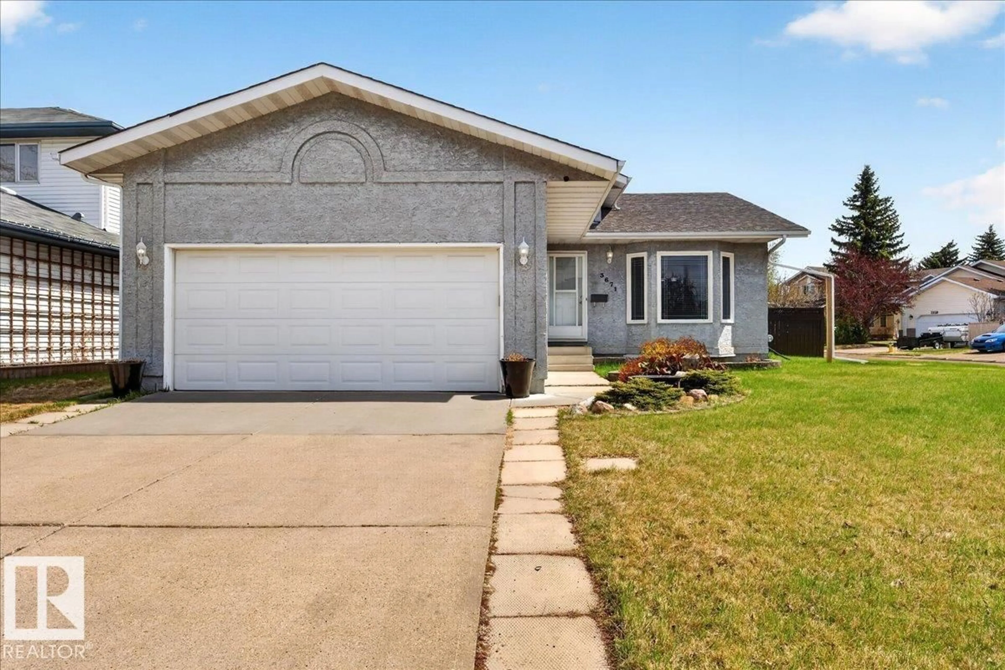 Home with vinyl exterior material, street for 3671 33 ST, Edmonton Alberta T6T1G2