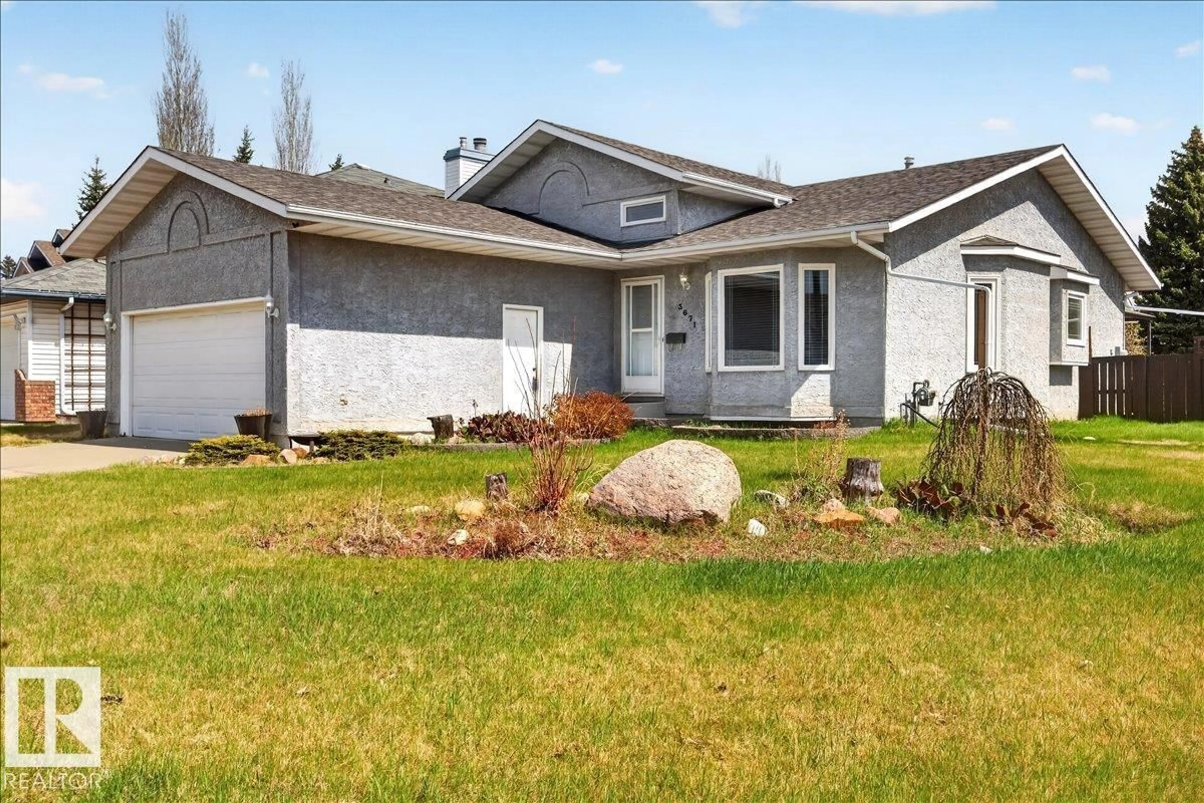 Home with vinyl exterior material, street for 3671 33 ST, Edmonton Alberta T6T1G2