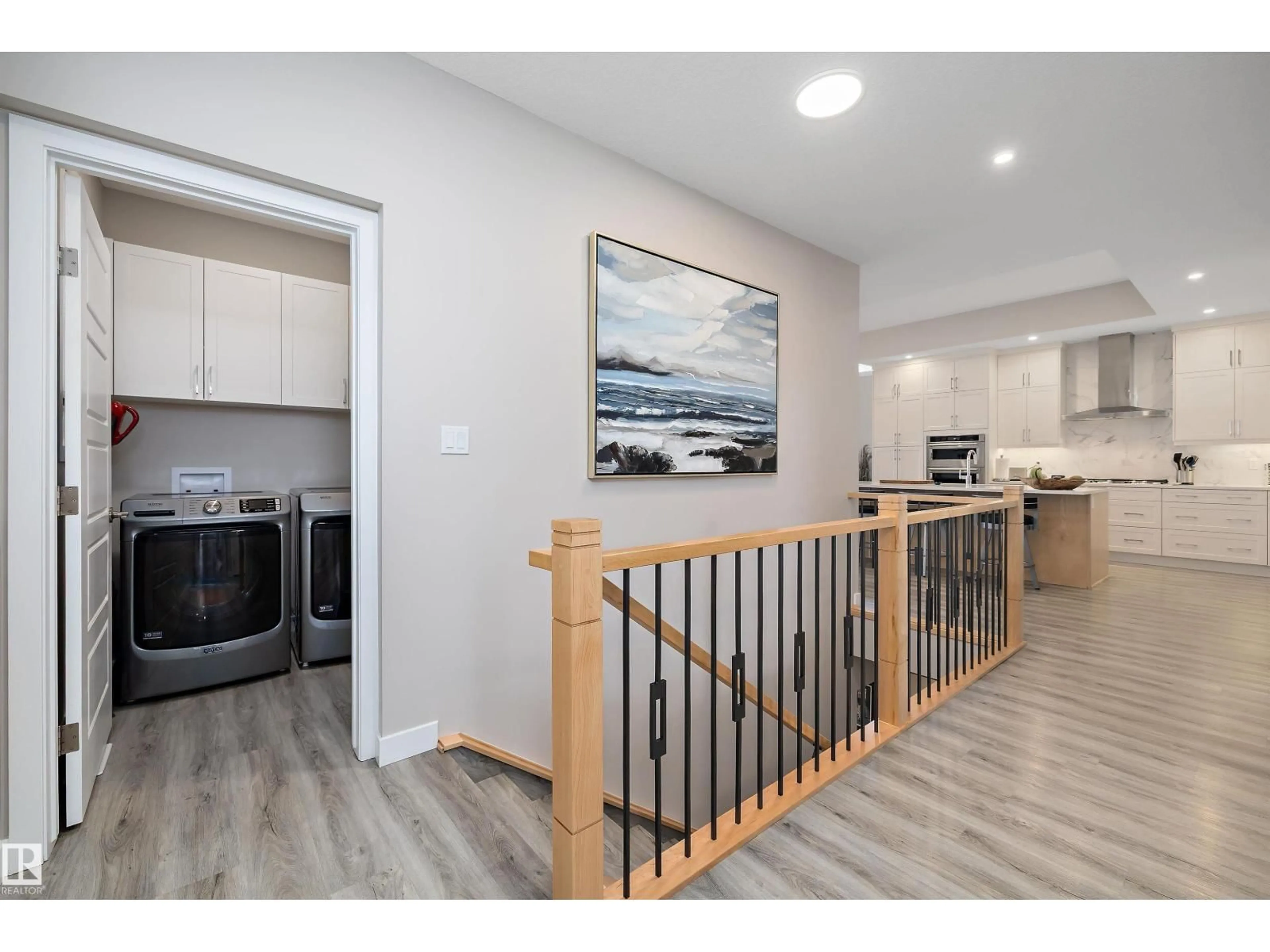 Open concept kitchen, wood/laminate floor for 166 EDGEWATER CI, Leduc Alberta T9E1K5