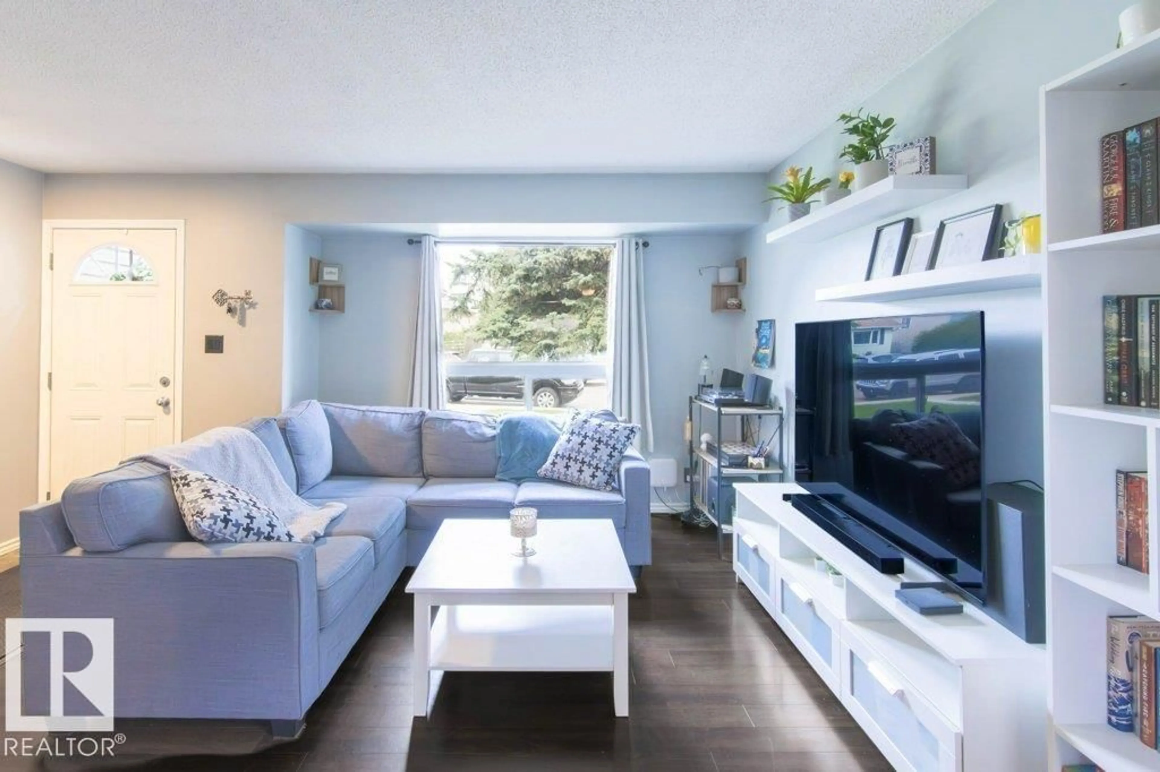 Living room with furniture, wood/laminate floor for 311 NORTHGATE TC, Edmonton Alberta T5E3R3