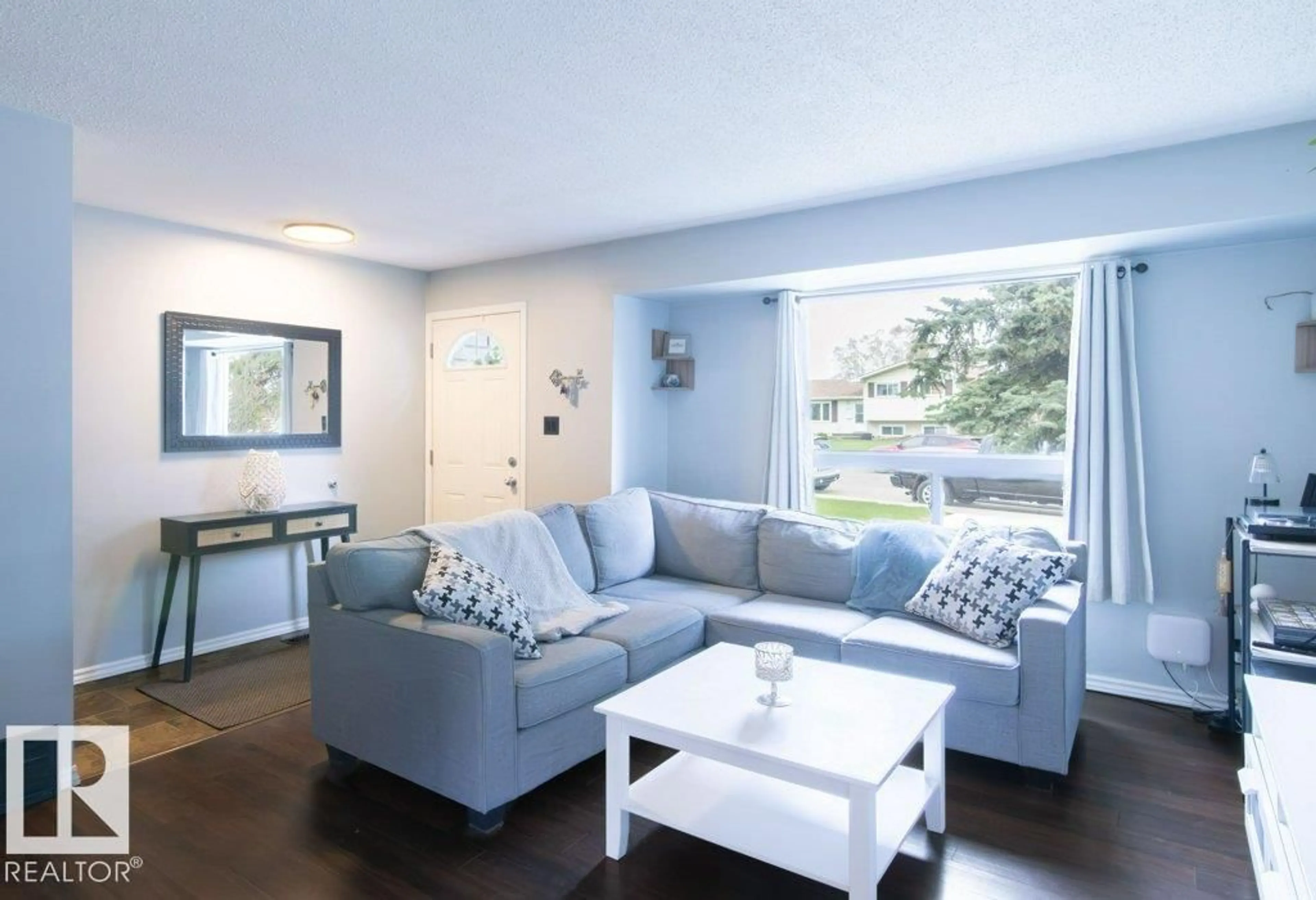 Living room with furniture, wood/laminate floor for 311 NORTHGATE TC, Edmonton Alberta T5E3R3