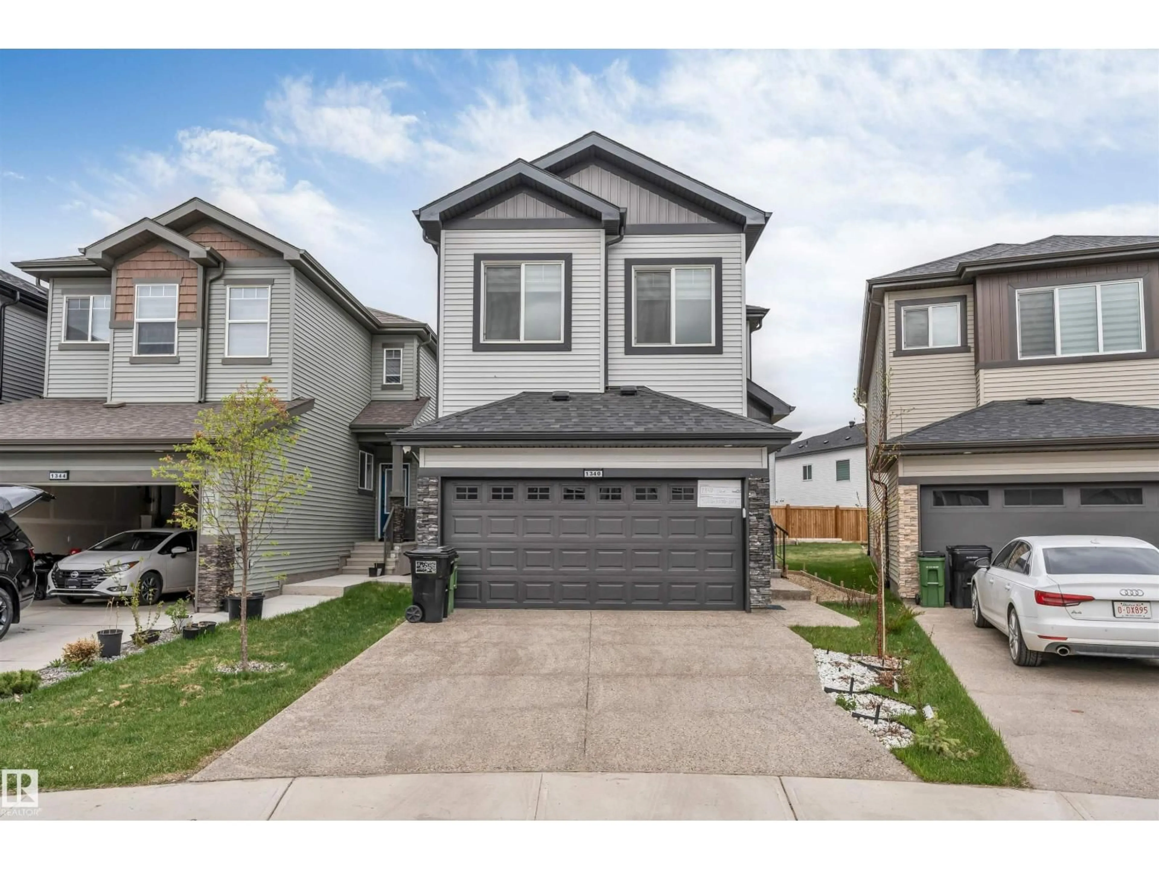 Home with vinyl exterior material, street for 1340 11 AV, Edmonton Alberta T6T2W4