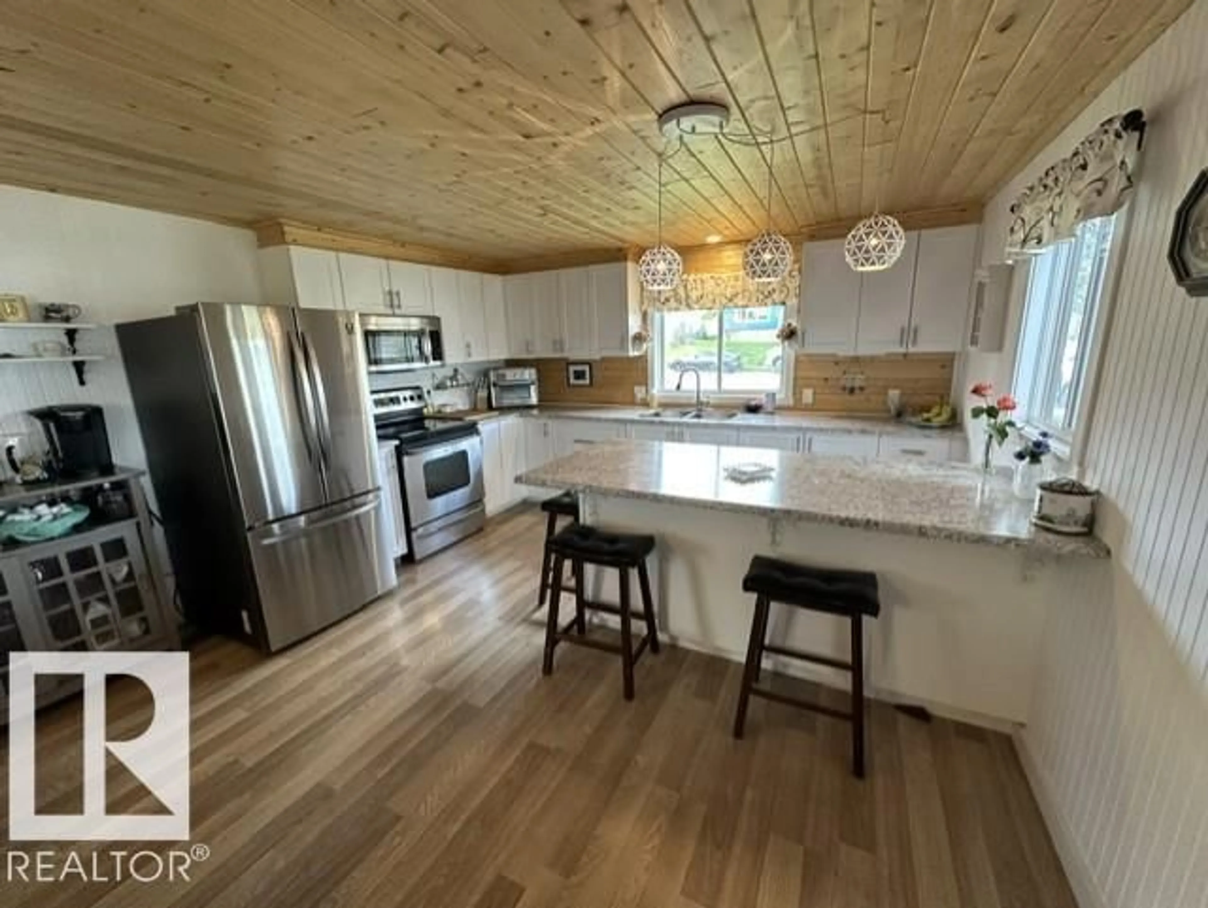 Open concept kitchen, wood/laminate floor for 5013 53 AV, Wabamun Alberta T0E2K0