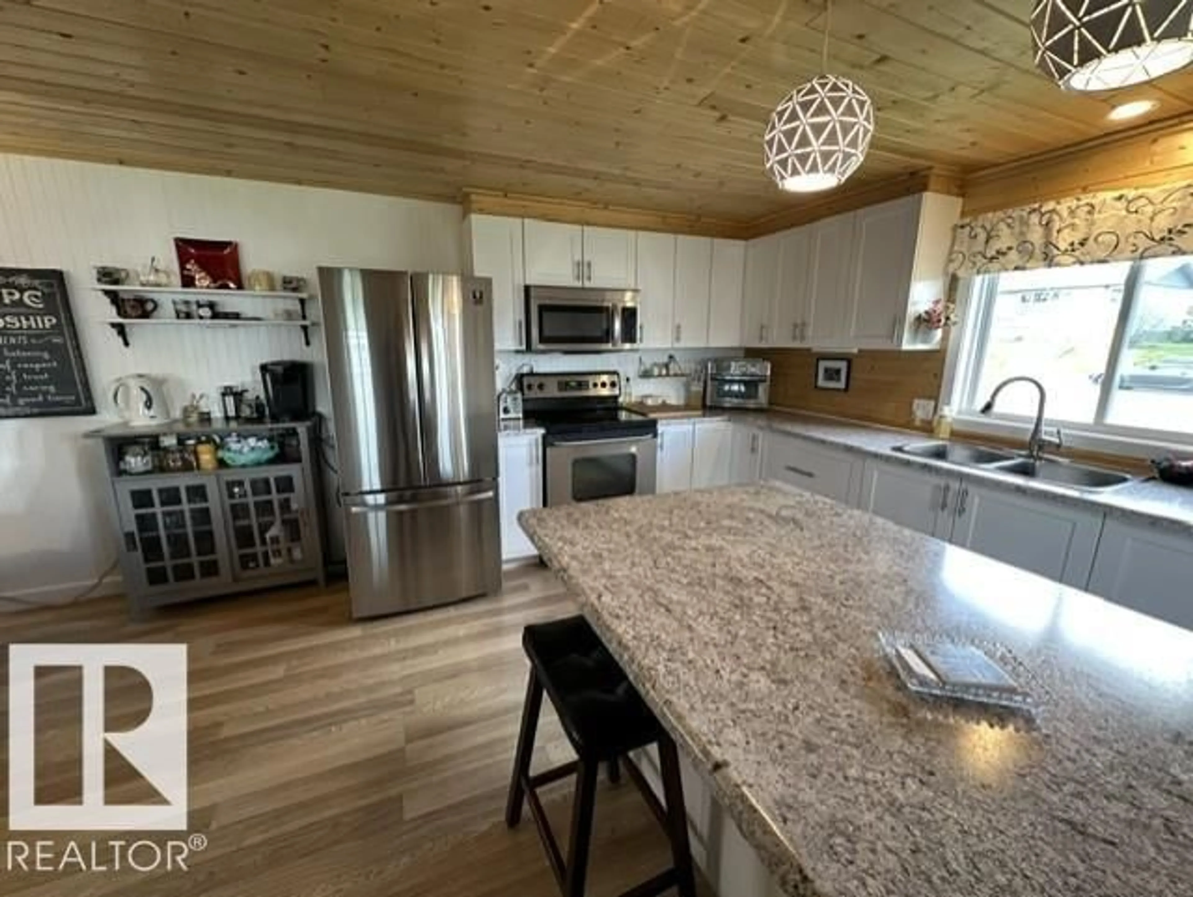 Open concept kitchen, wood/laminate floor for 5013 53 AV, Wabamun Alberta T0E2K0