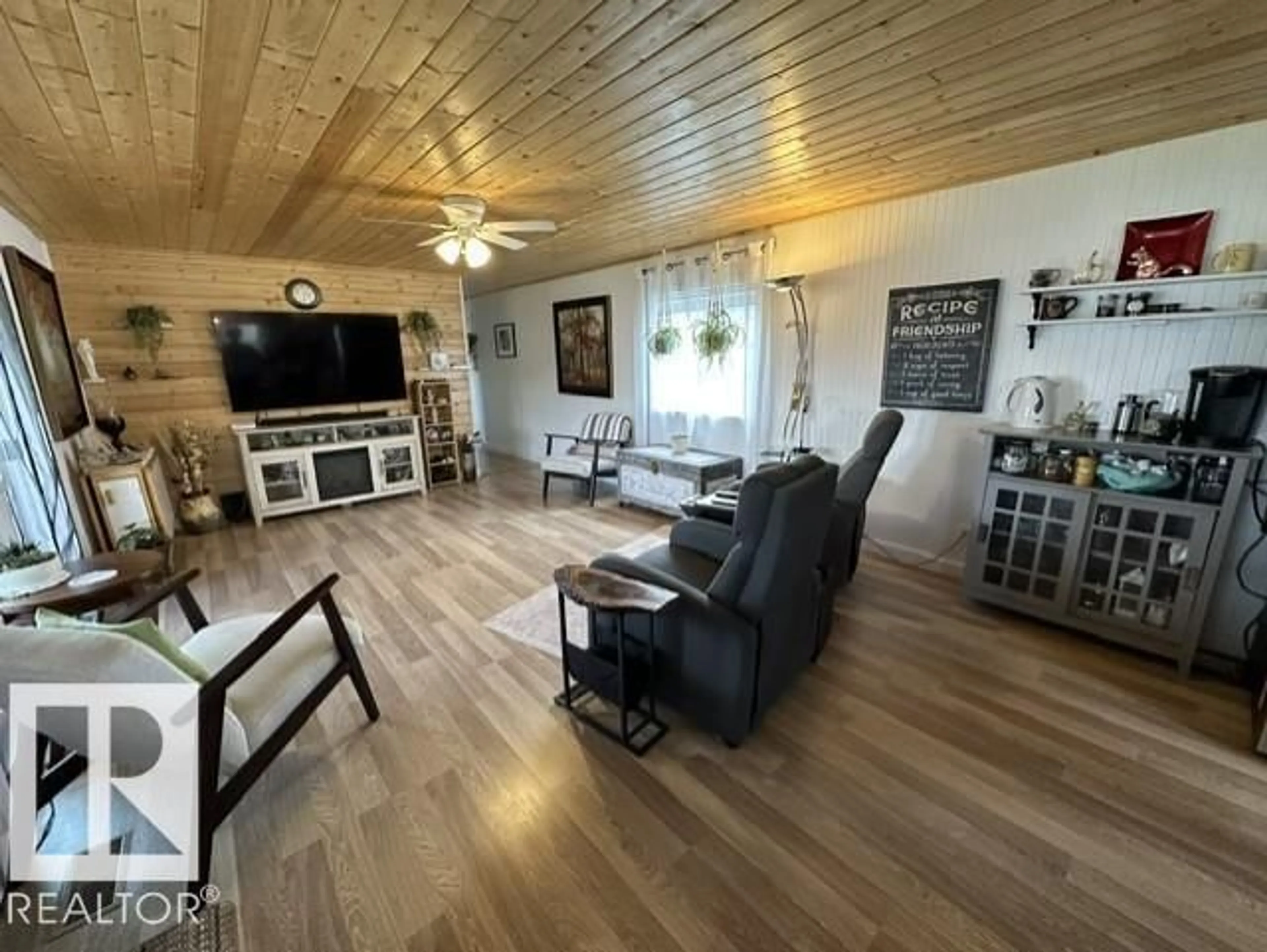 Living room with furniture, wood/laminate floor for 5013 53 AV, Wabamun Alberta T0E2K0