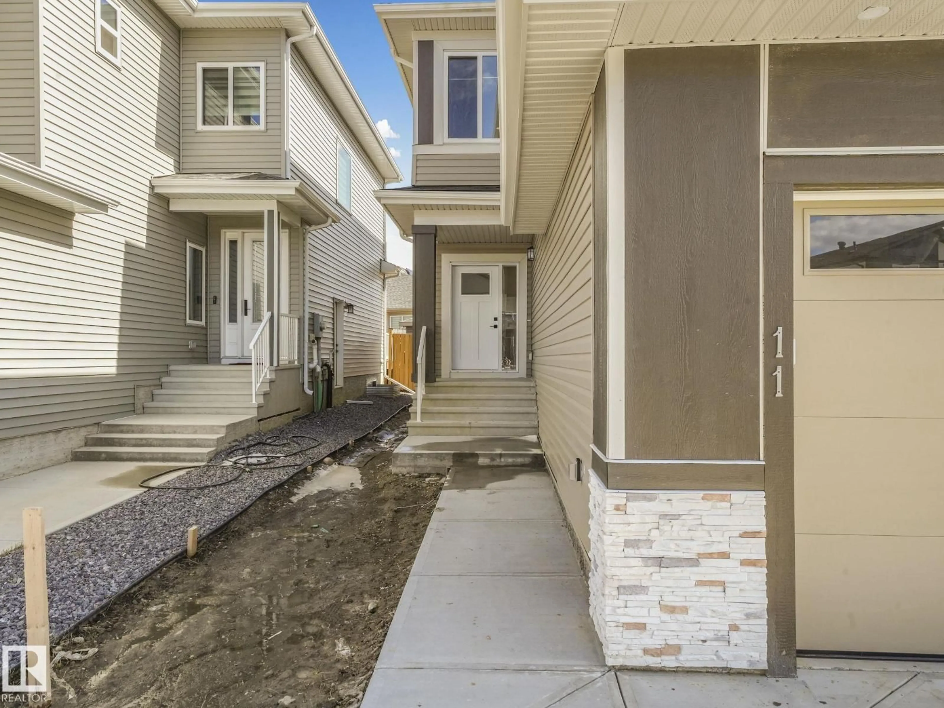 Home with vinyl exterior material, street for 11 DALQUIST BA, Leduc Alberta T9E1N7