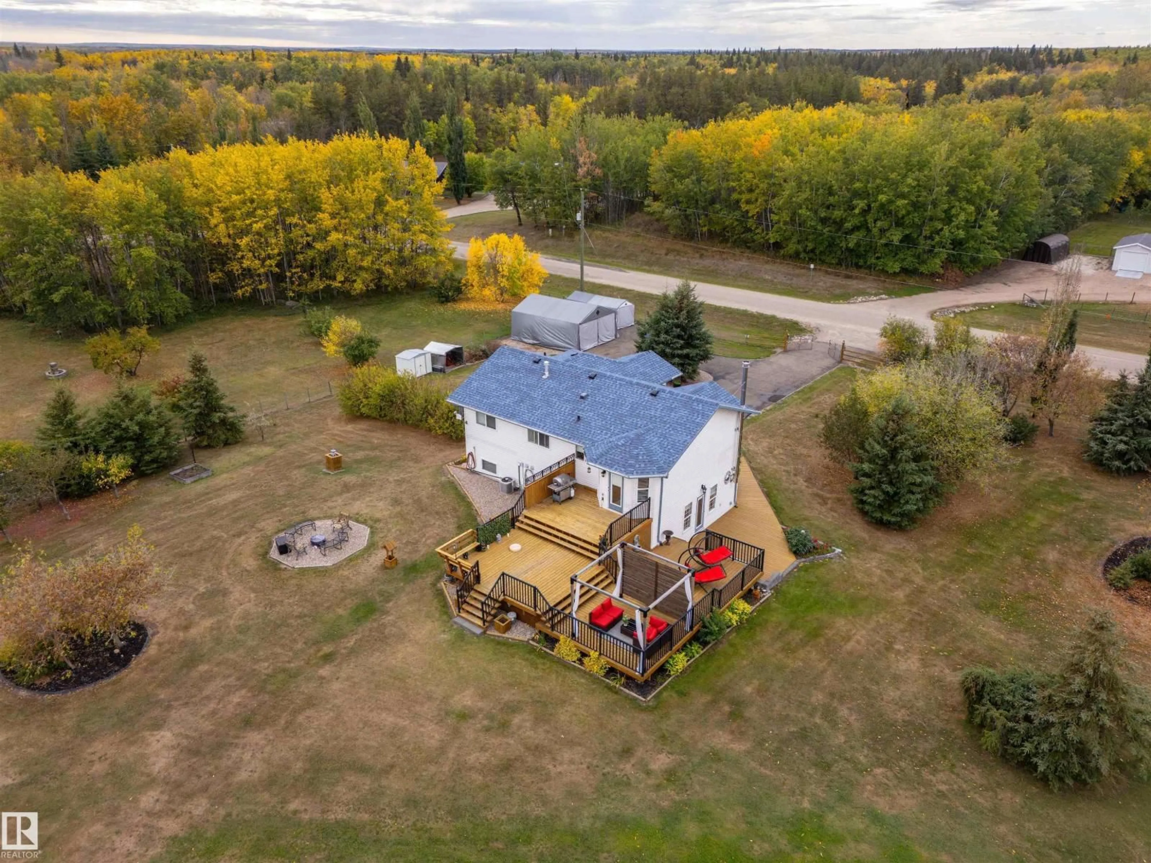 A pic from outside/outdoor area/front of a property/back of a property/a pic from drone, unknown for 5121 PINE DR, Cherry Grove Alberta T0A0T0