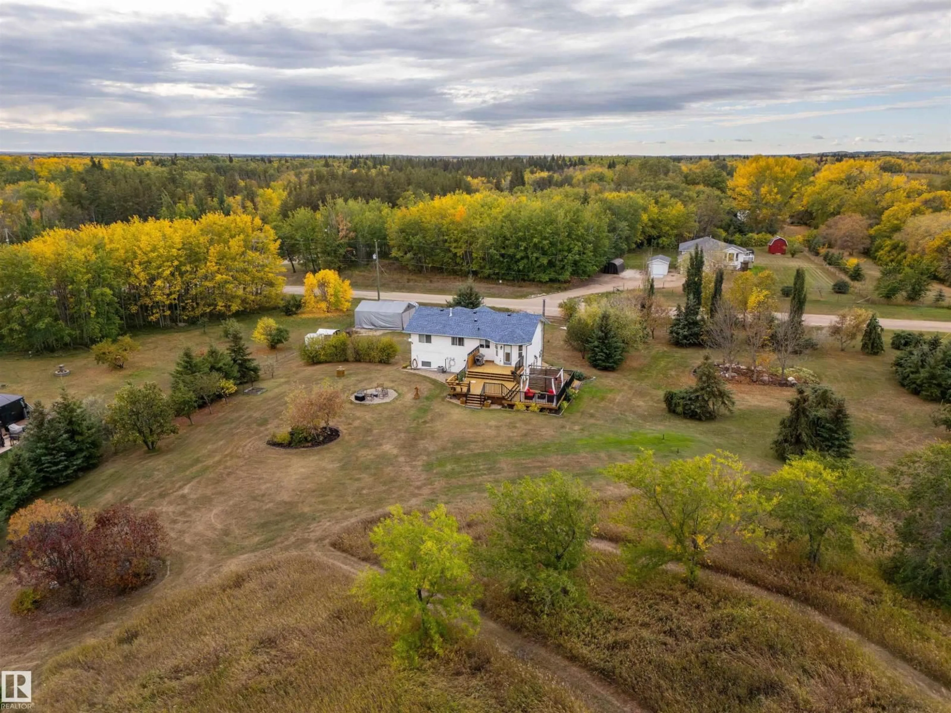 A pic from outside/outdoor area/front of a property/back of a property/a pic from drone, water/lake/river/ocean view for 5121 PINE DR, Cherry Grove Alberta T0A0T0