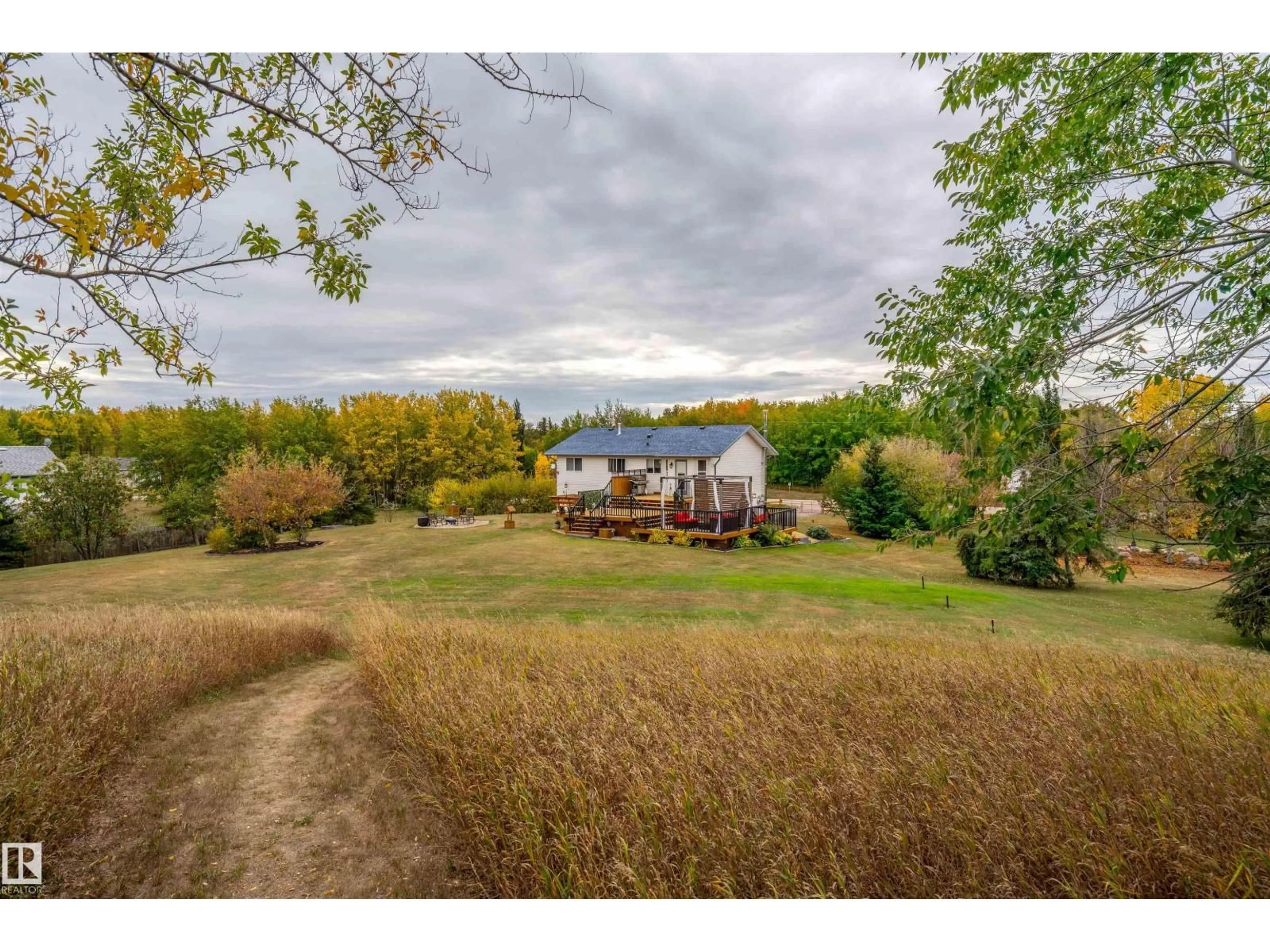 A pic from outside/outdoor area/front of a property/back of a property/a pic from drone, water/lake/river/ocean view for 5121 PINE DR, Cherry Grove Alberta T0A0T0